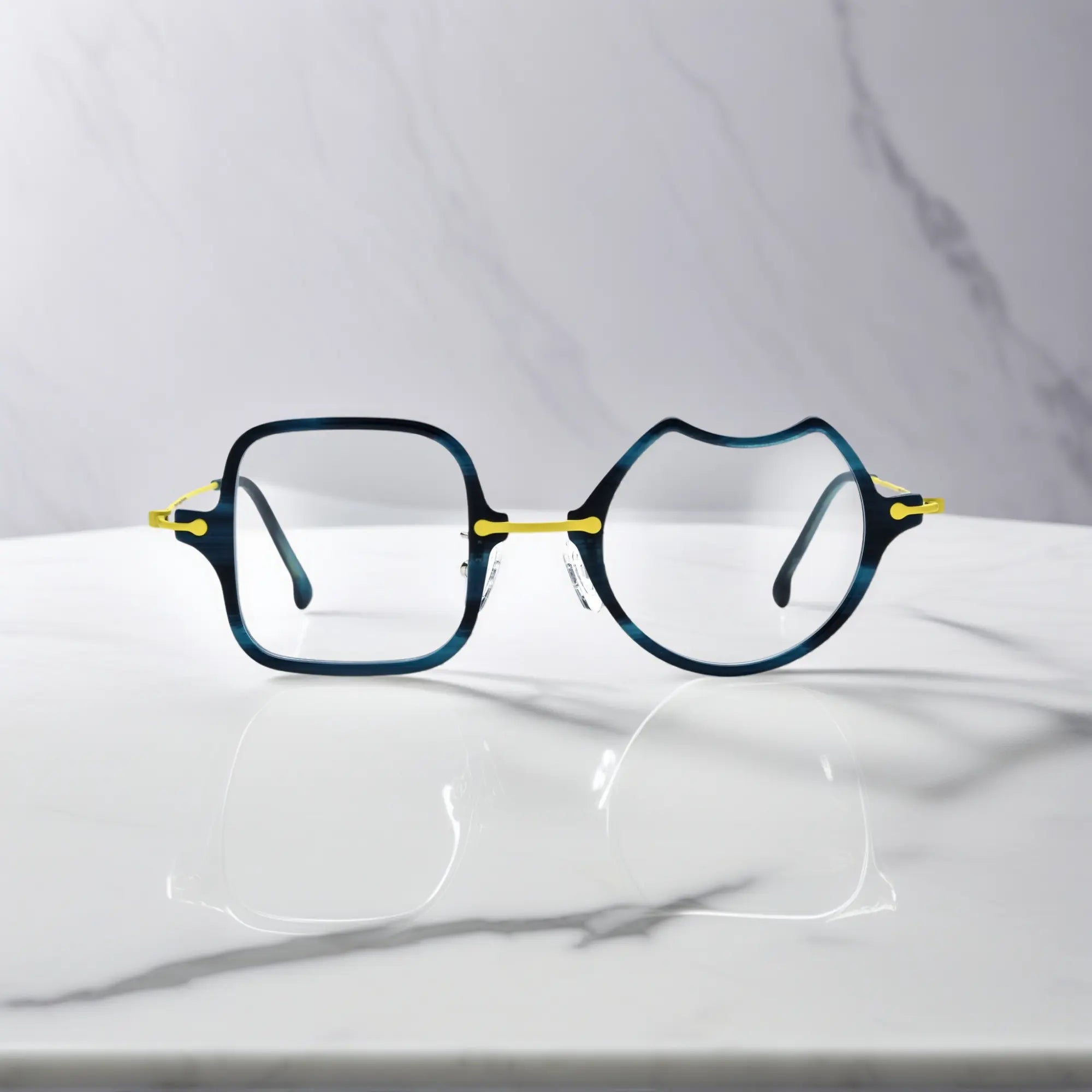 Front View of VoyueLens™ Electric Olive bold abstract eyeglasses VL185842-C5. Close-up of the front-facing design showing the asymmetric lens combination with acetate finish.