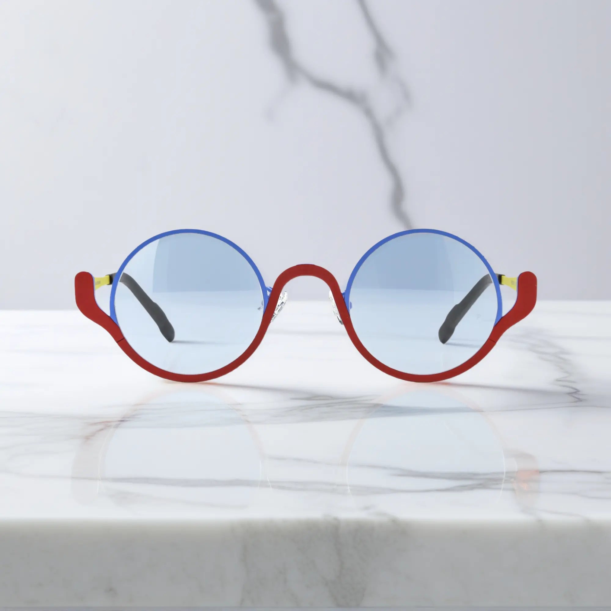 Front view of VoyueLens™ ChromoPop eyeglasses in Electric Rust – blue and red titanium mix