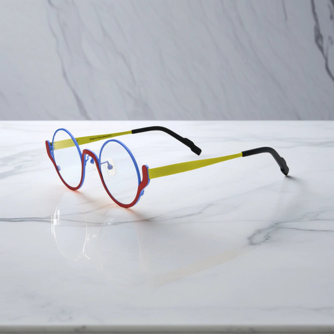 Side profile of Electric Rust VoyueLens™ glasses – bold contrast of colors in metal frame