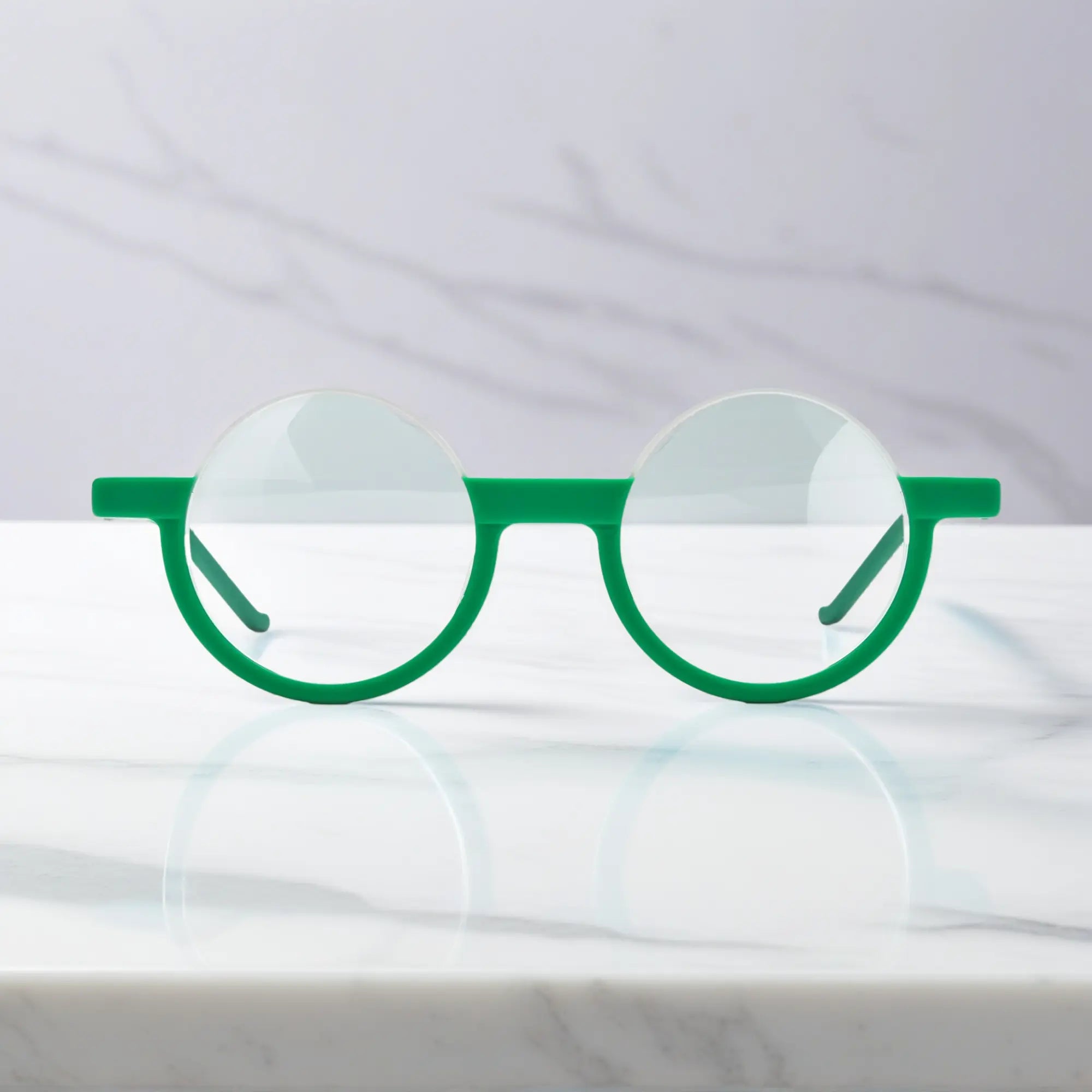 Front view of Emerald Ice VoyueLens™ eyeglasses featuring frosted green-white tones in elegant round styling.