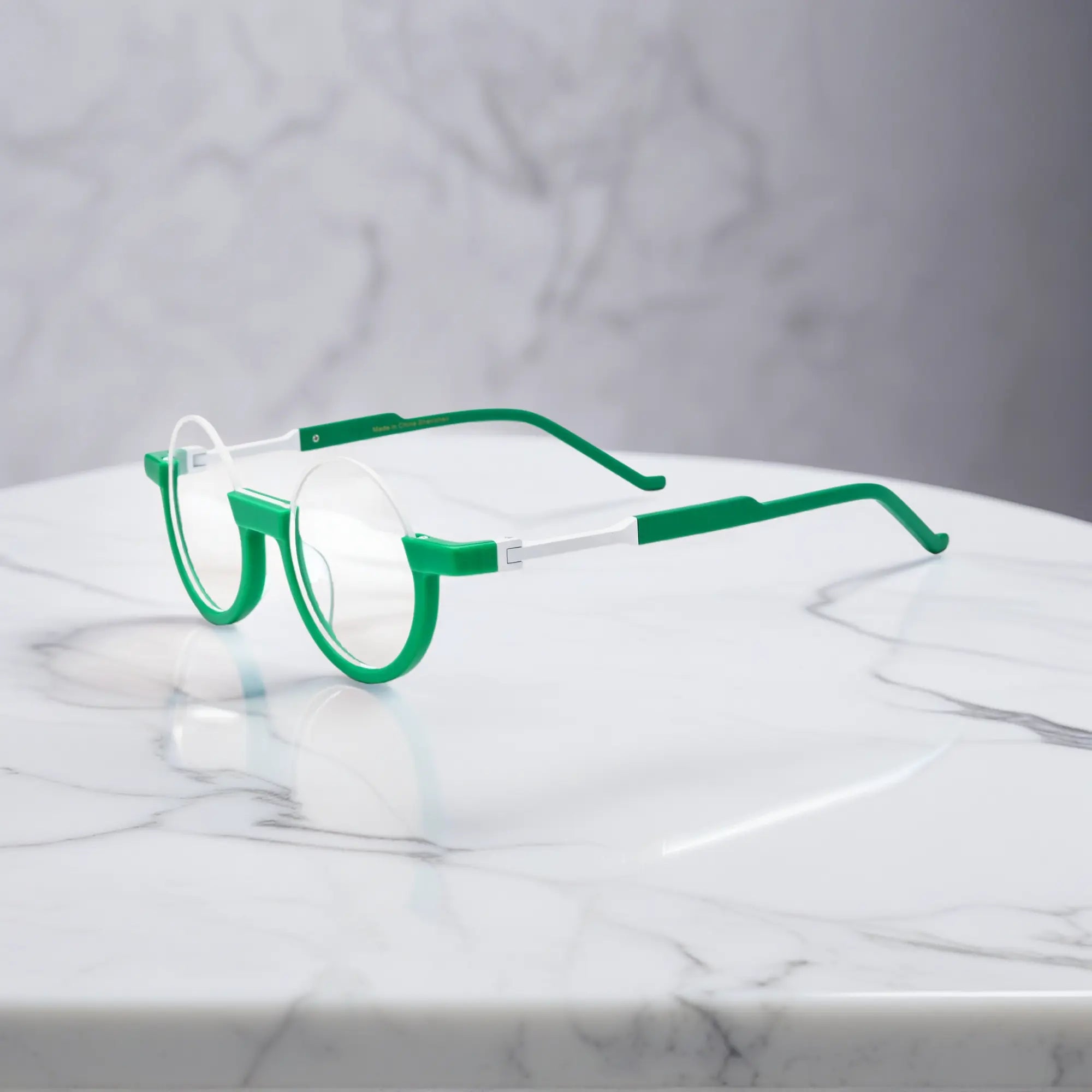 Side view of Emerald Ice frame with cool mint temples and balanced translucent palette.