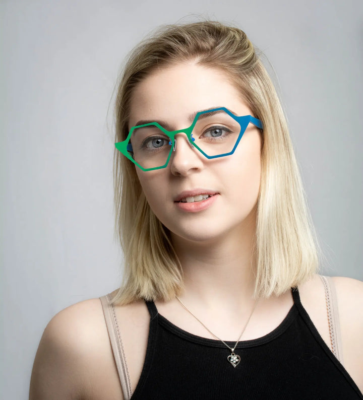 Model wearing VoyueLens™ VL185881 in Emerald Wave – vibrant green-blue titanium frame