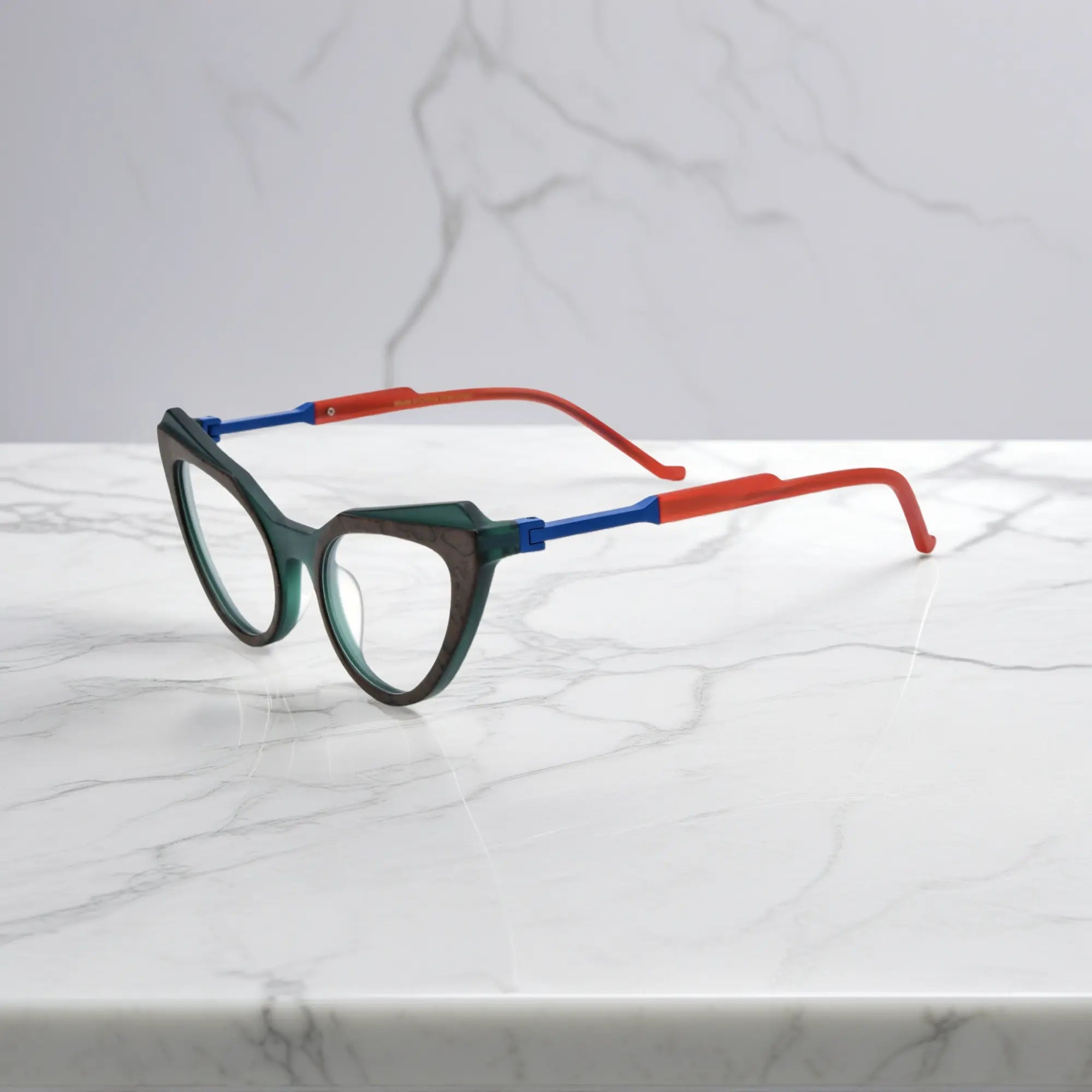 Side profile of Forest Marble VoyueLens™ butterfly eyeglasses with translucent green acetate arms and spring hinges.