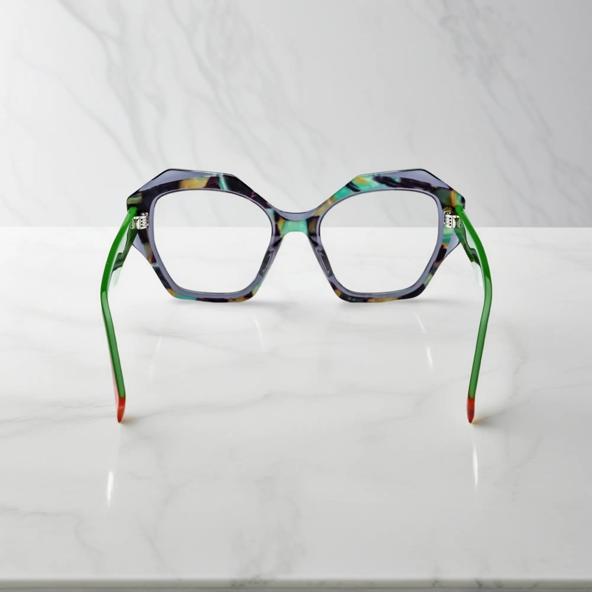 Rear view highlighting color-blocked orange tips and lightweight spring hinge construction.