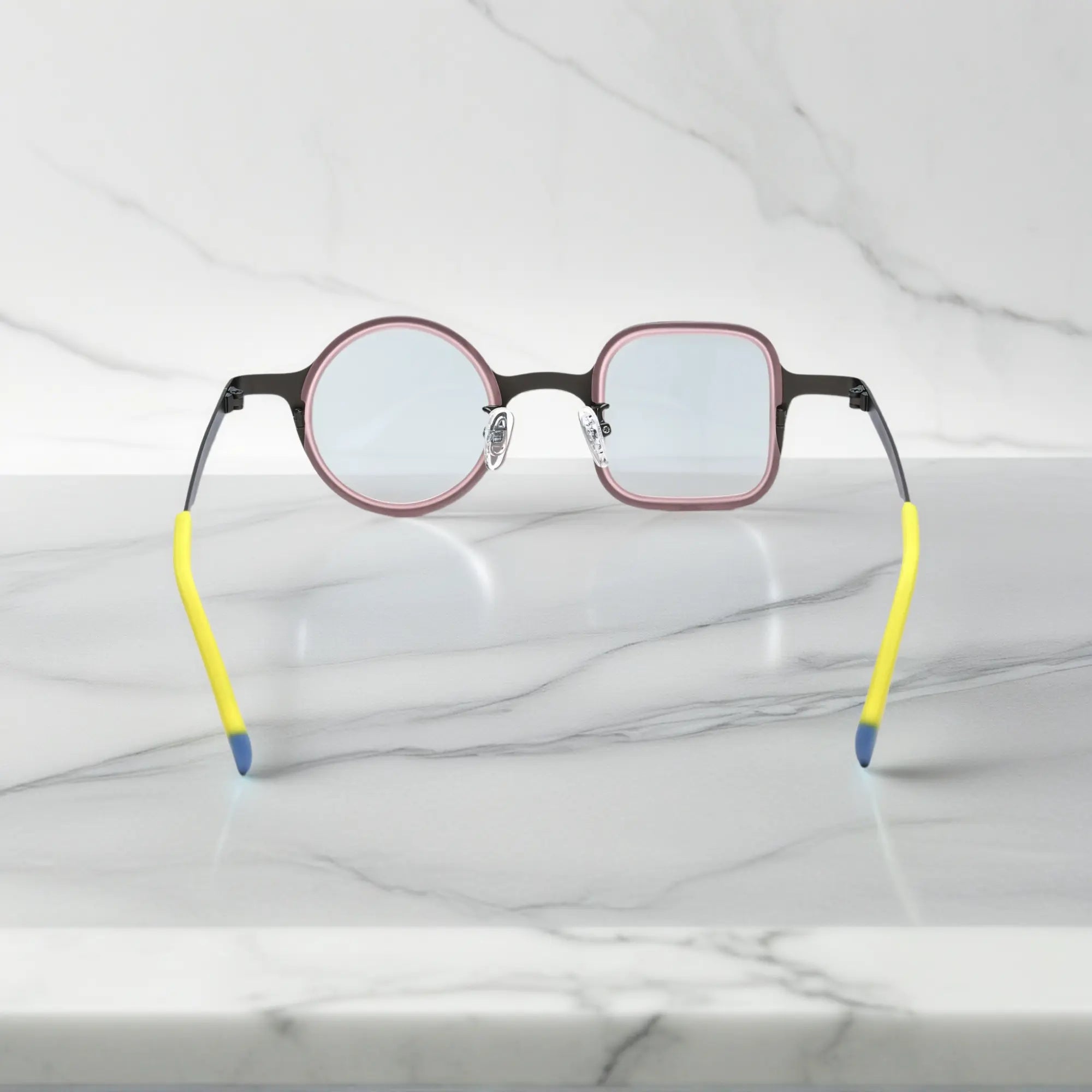 Rear perspective of VoyueLens™ Graphite Blush, showing asymmetric style from behind.