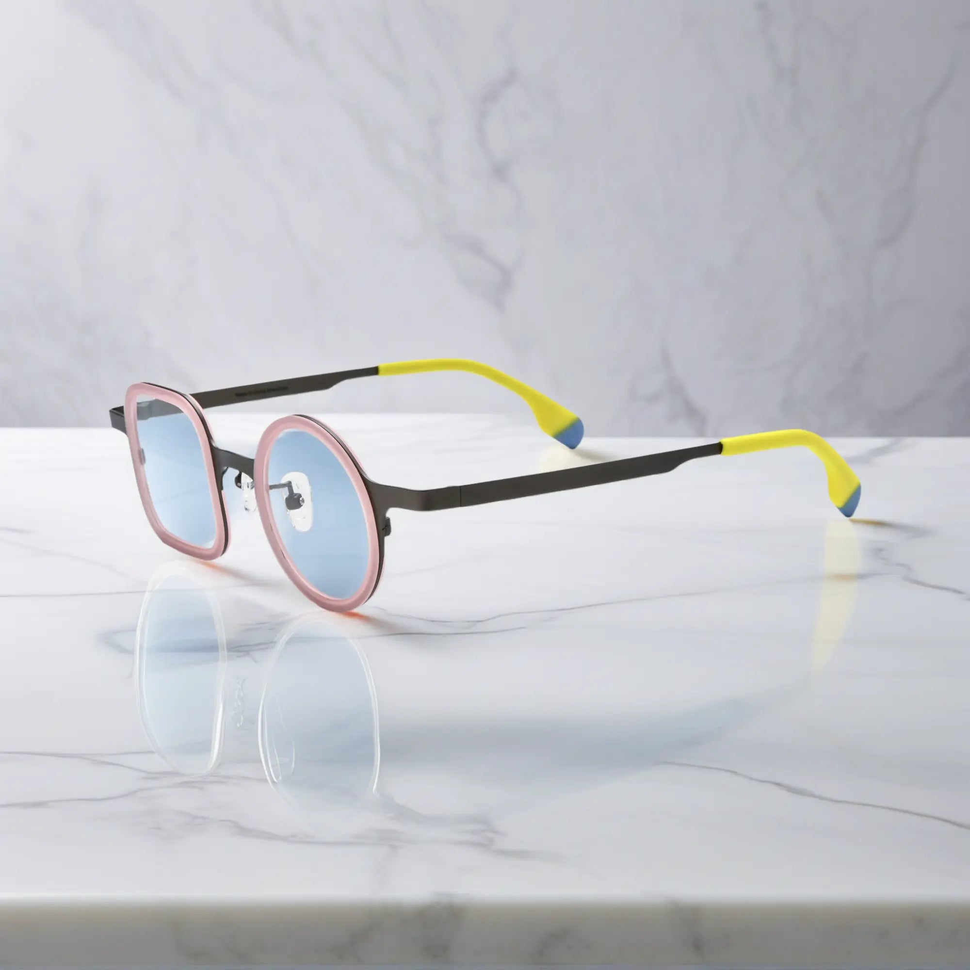 Side view of Graphite Blush titanium temples blending with soft blush acetate frame.