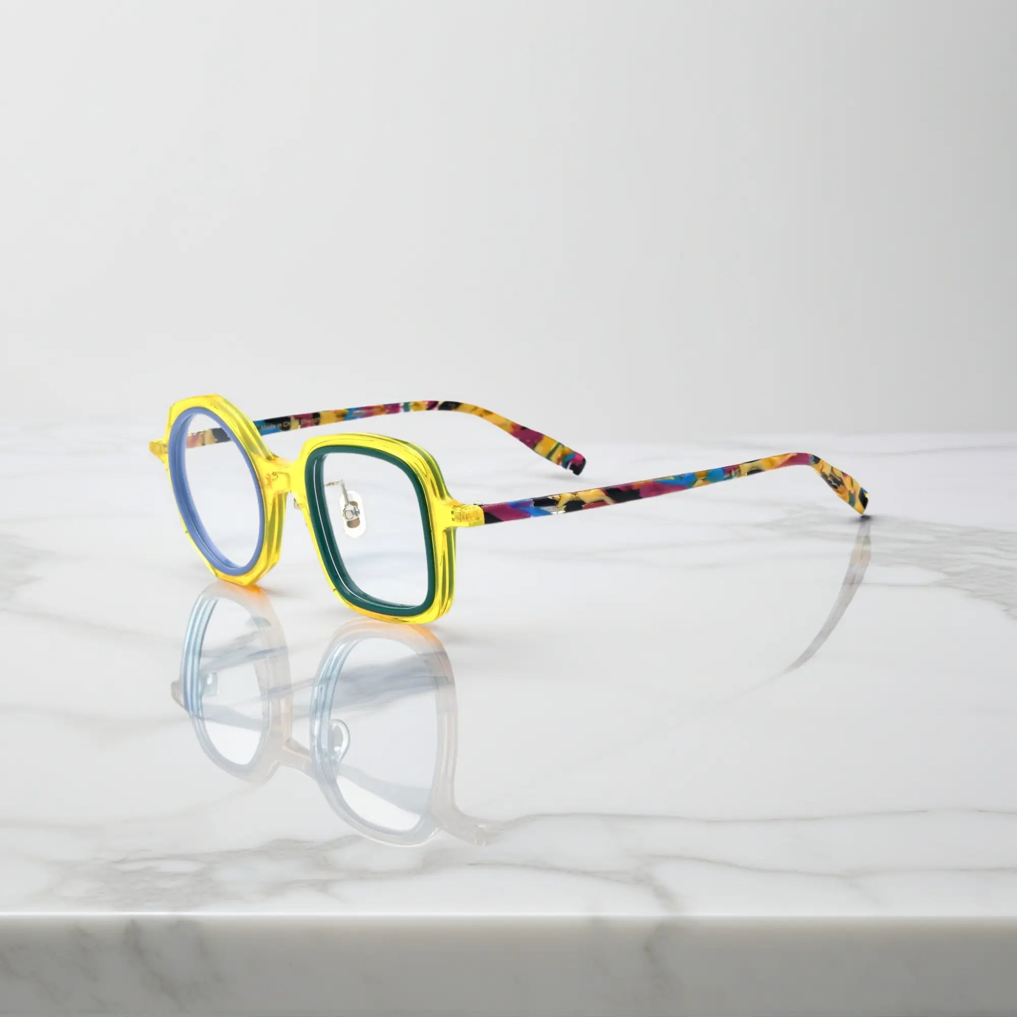 VoyueLens™ geometric eyeglasses in Honey Mint color, side view showing dual-tone design and spring hinges.