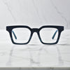 Front view of VoyueLens™ Indigo Mist eyeglasses with deep blue matte finish