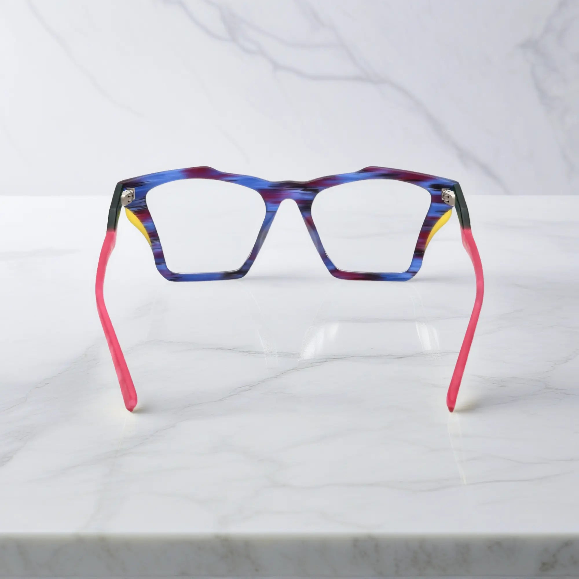 Rear view of VoyueLens™ Indigo Wave frame, displaying matte striped indigo with flowing tonal patterns from the inner frame and hinge area.