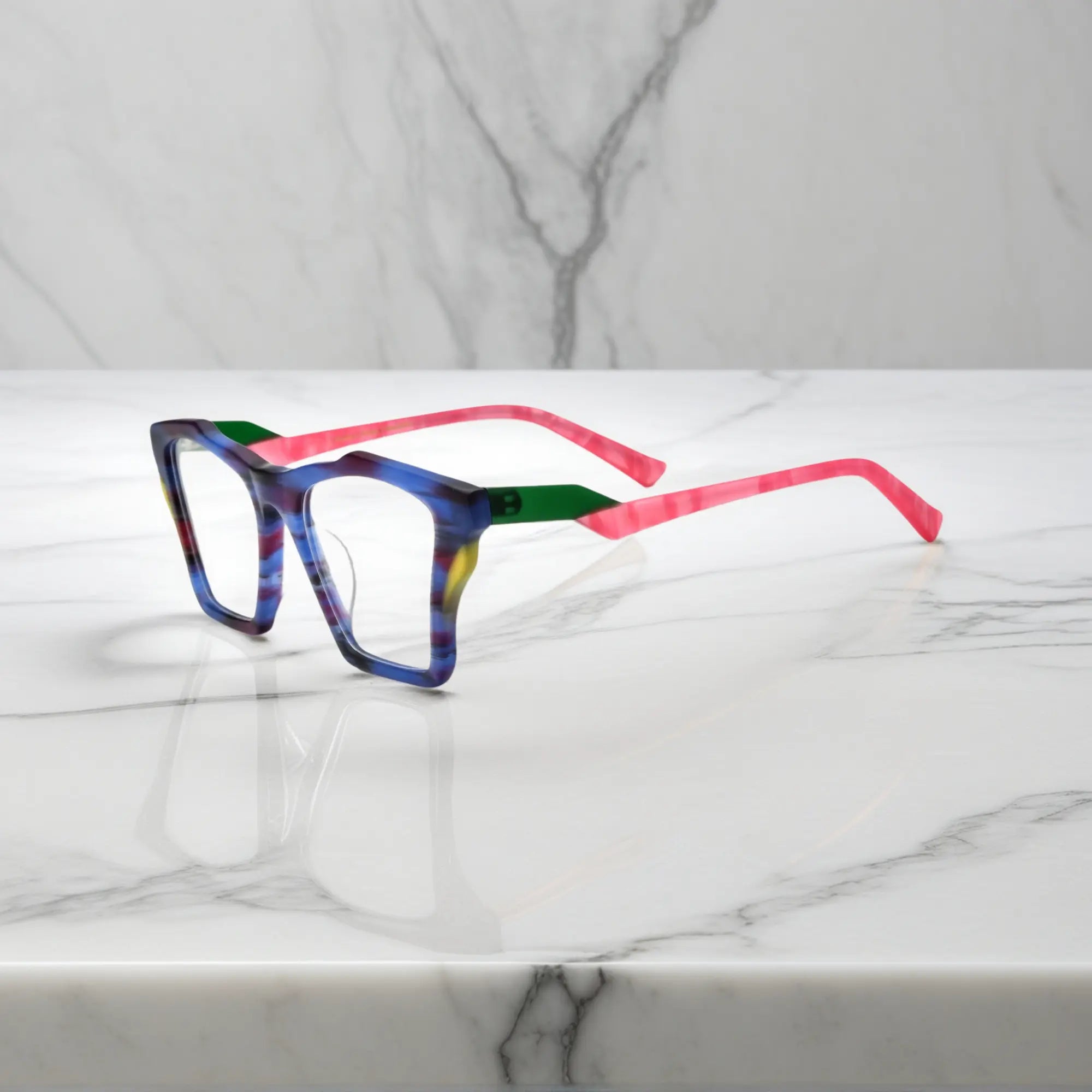 Side profile of VoyueLens™ Indigo Wave glasses, highlighting matte striped indigo with flowing tonal patterns and ergonomic acetate arms.