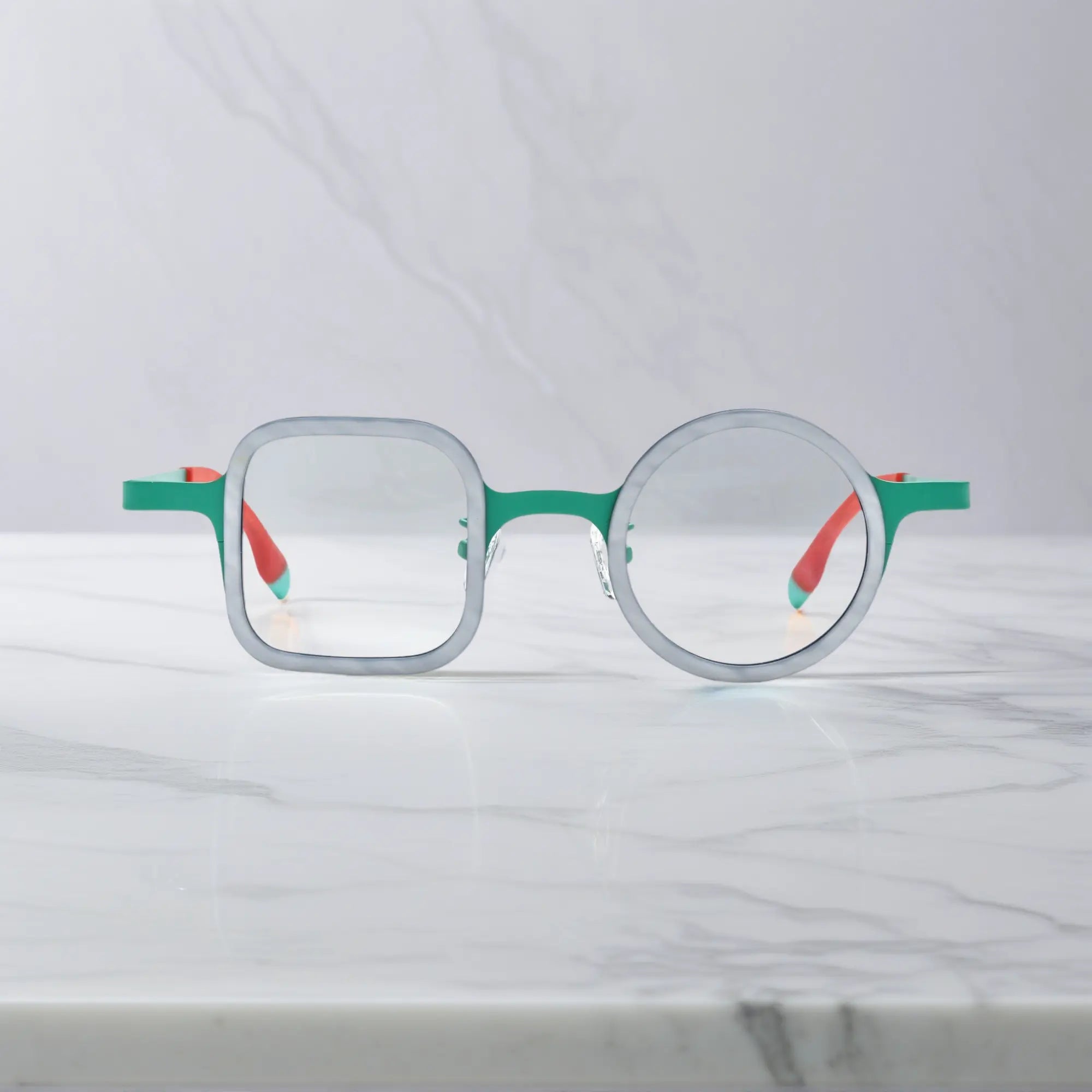 Front-facing image of Jade Blue eyeglasses, featuring a matte acetate front with blue tones.