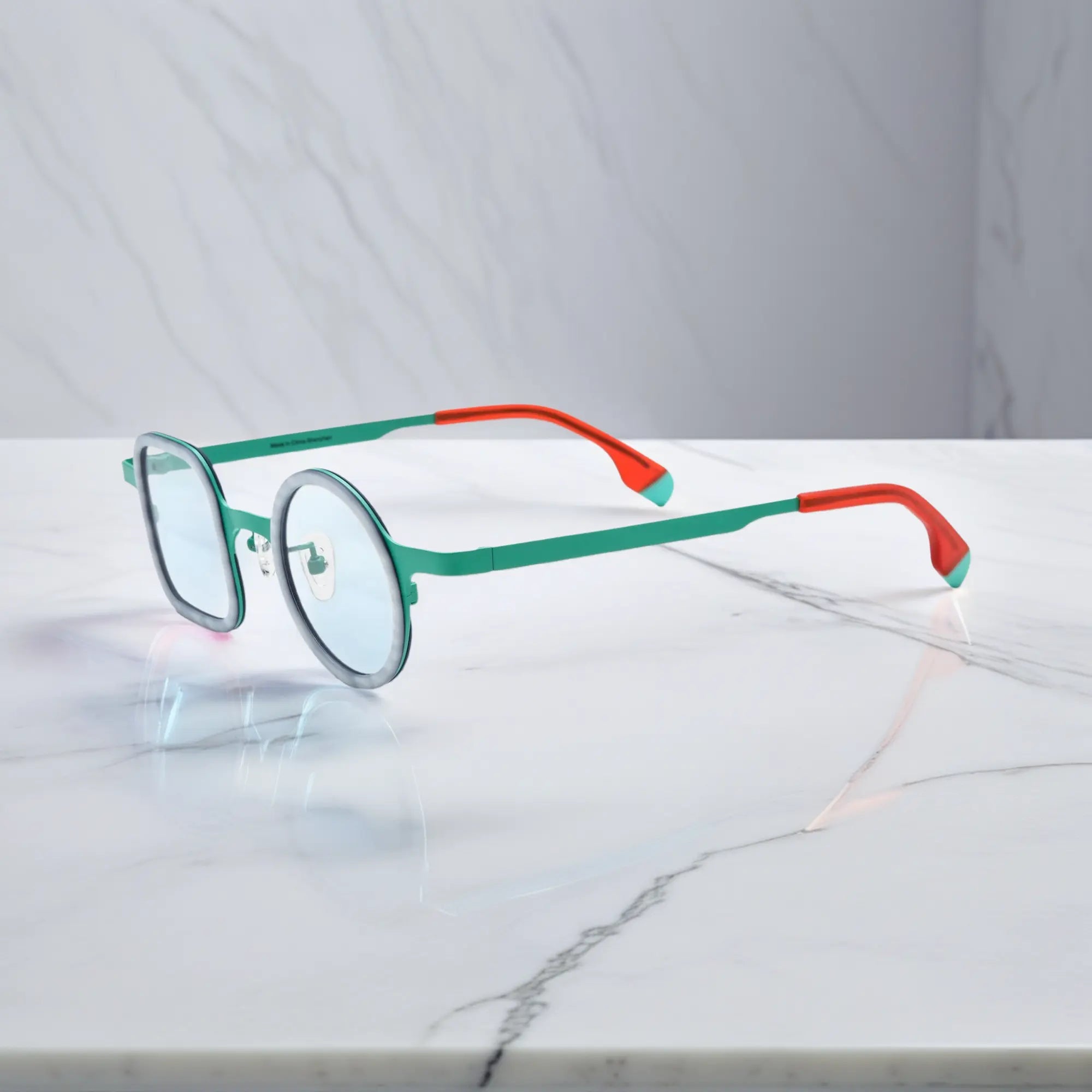 Side view highlighting titanium temples and sleek dual-color design.