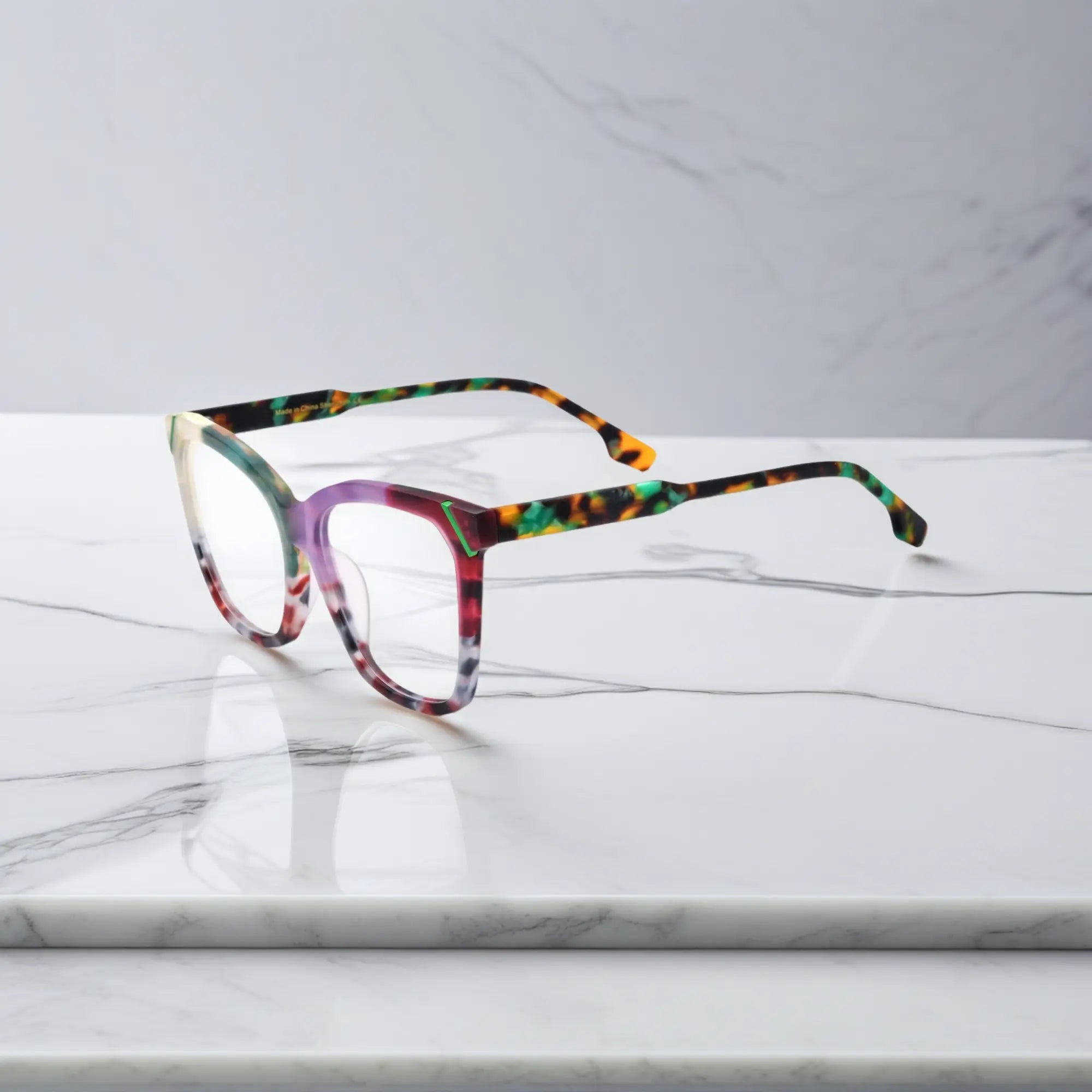 VoyueLens VL19343 Jade Green & Plum Tortoise matte acetate square eyeglasses (unisex) are shown from the side view, highlighting the unique two-tone color scheme on the temple.