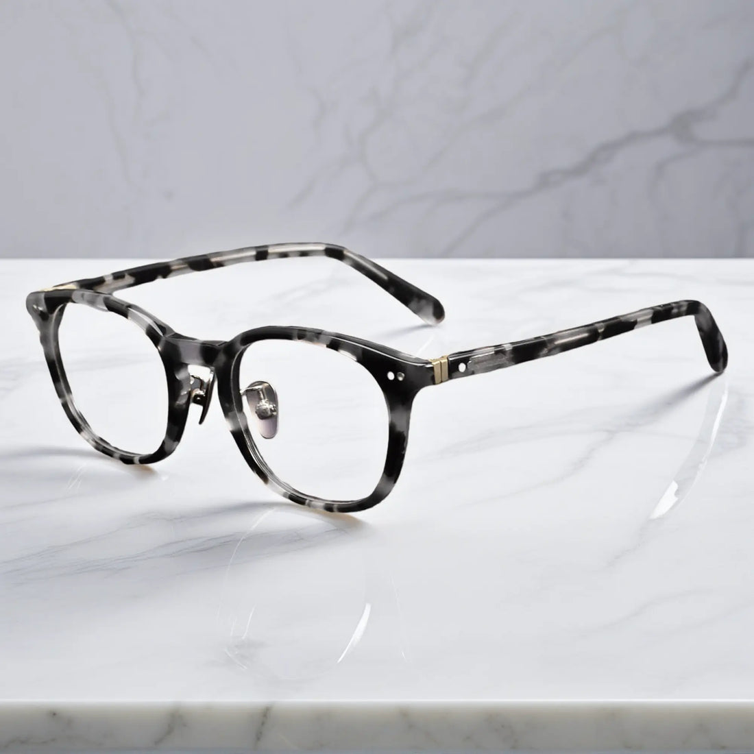 side view showing titanium nose pads and metal rivet hinge detail of KA62 leopard tortoise color frame