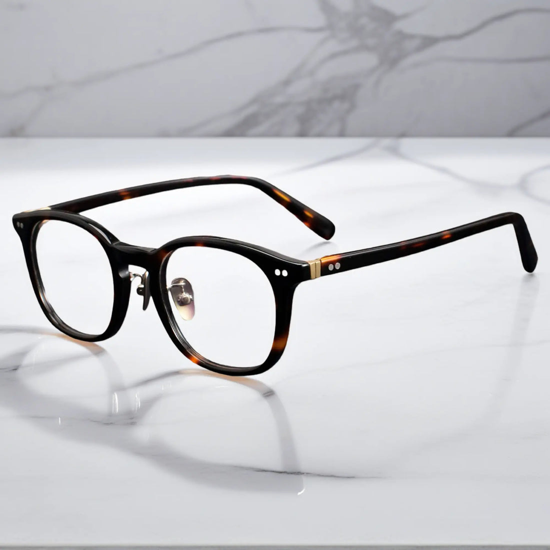 side view showing titanium nose pads and metal rivet hinge detail of KA62 tortoise color frame