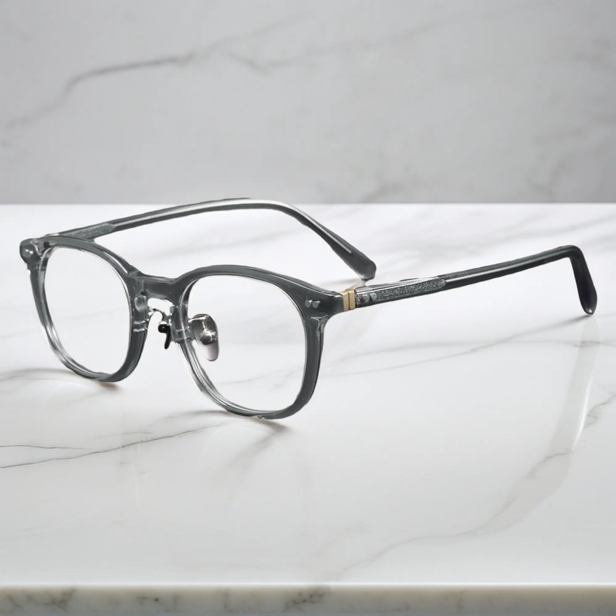 side view showing titanium nose pads and metal rivet hinge detail of KA62 transparent gray color frame