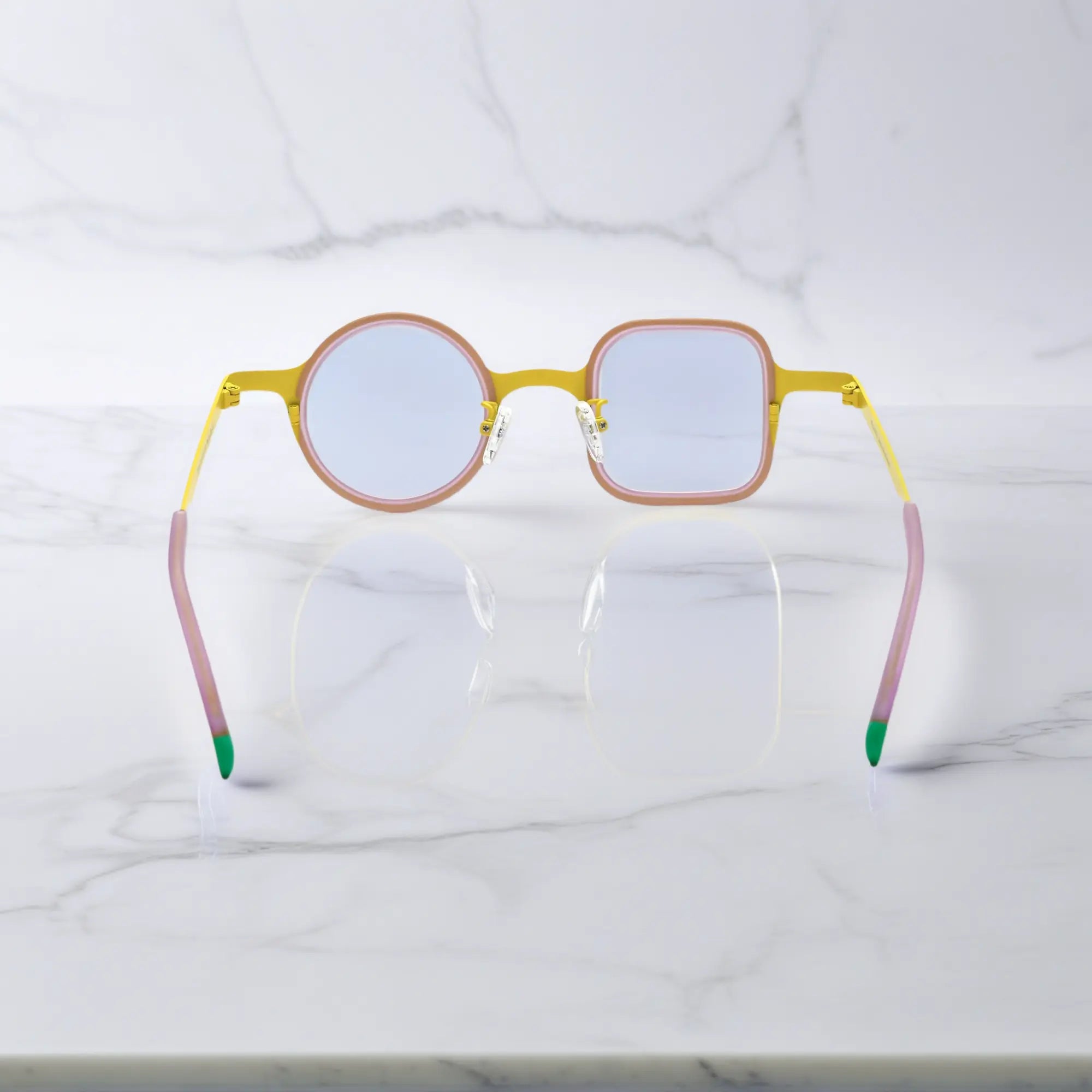 Rear view of Lemon Pink eyeglasses showcasing curve-fit temples and color-block tips.