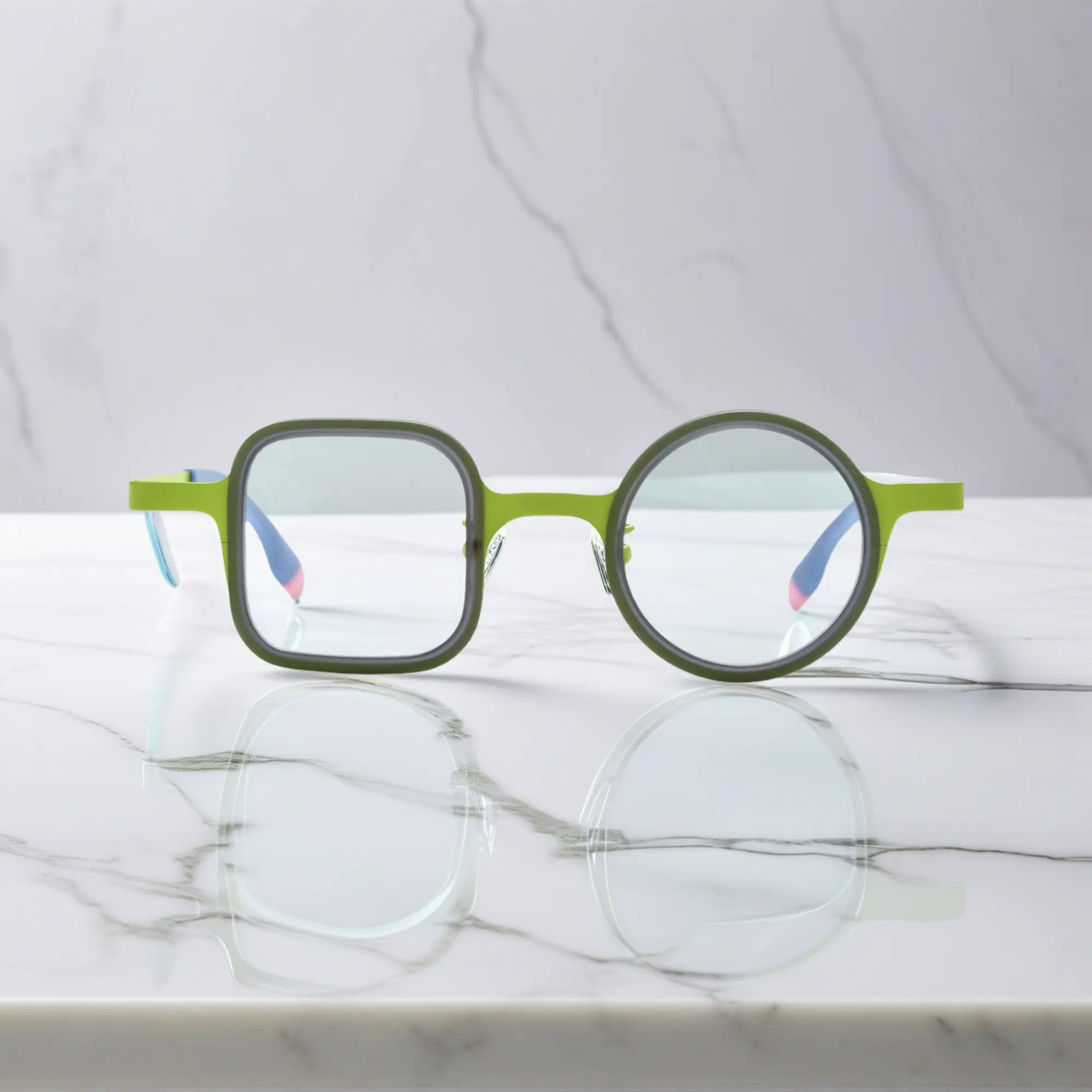 Front view of Meadow Green VoyueLens™ glasses with soft green acetate and titanium temples.