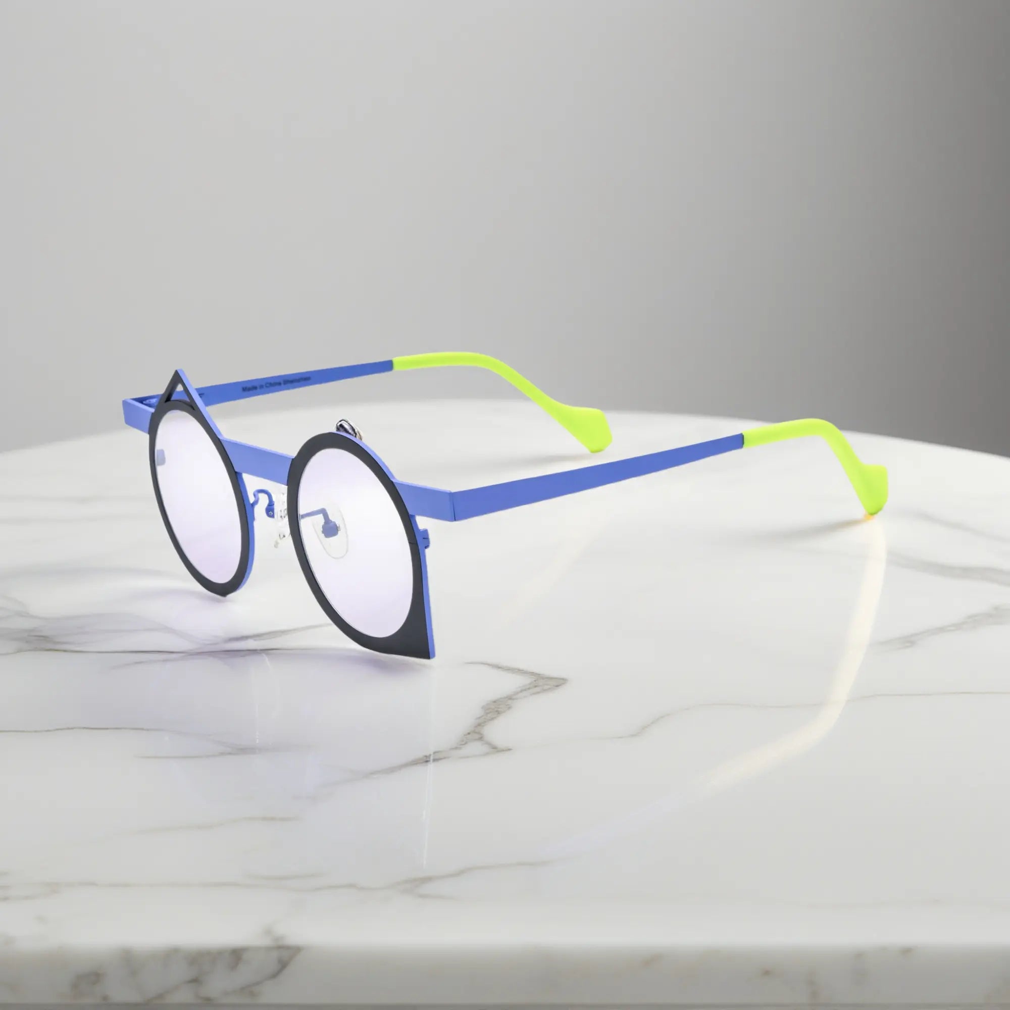 Side profile of VoyueLens™ Midnight Neon titanium eyeglasses highlighting its bold artistic polygonal structure.