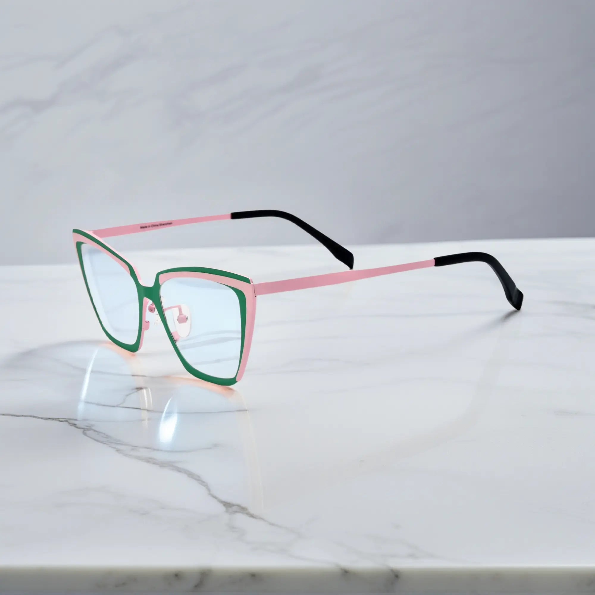 Side profile of green-pink VoyueLens™ VL185809 Mint Blush titanium glasses