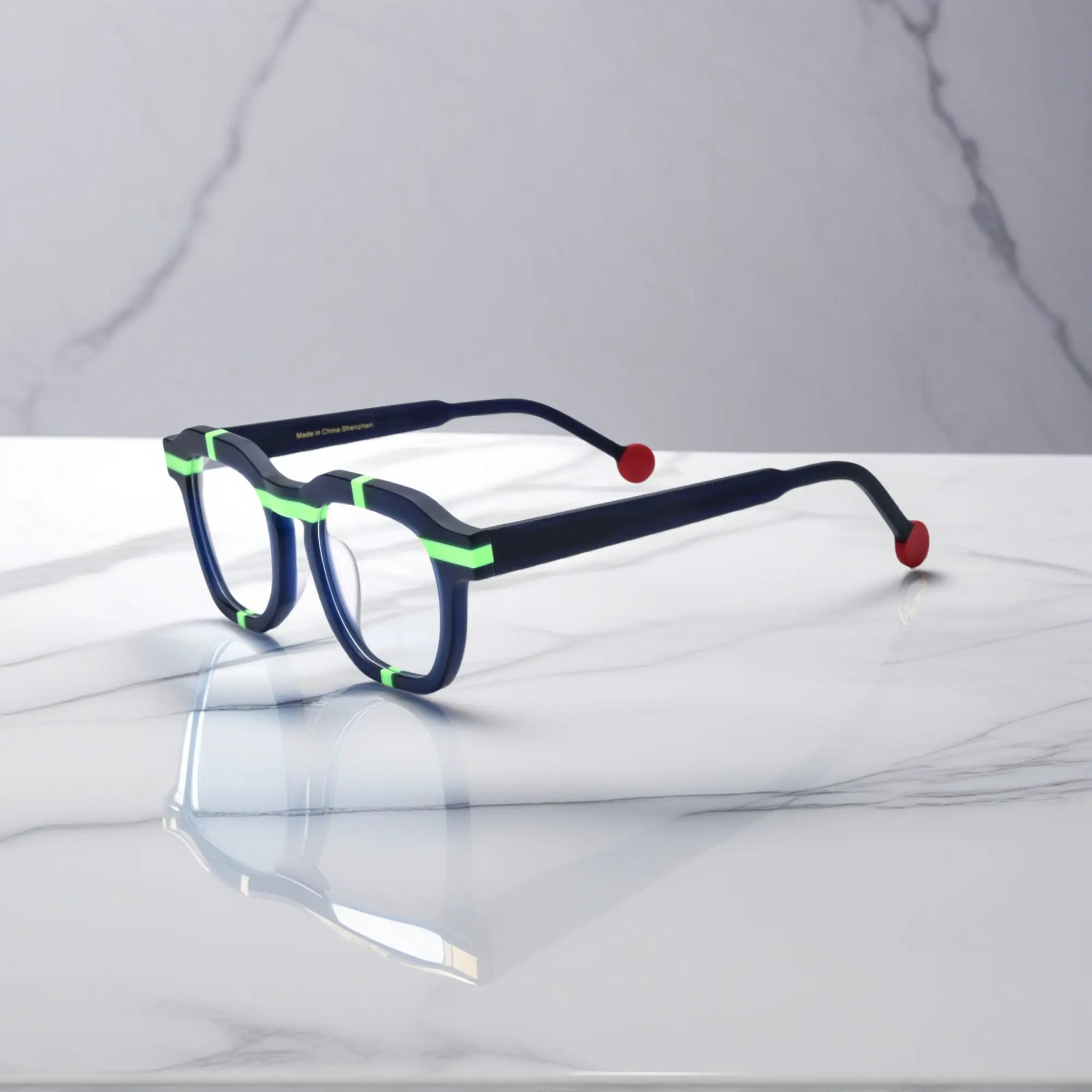 Side view of VoyueLens™ VL19363 Navy Bolt matte navy eyeglasses with green accents and red tips