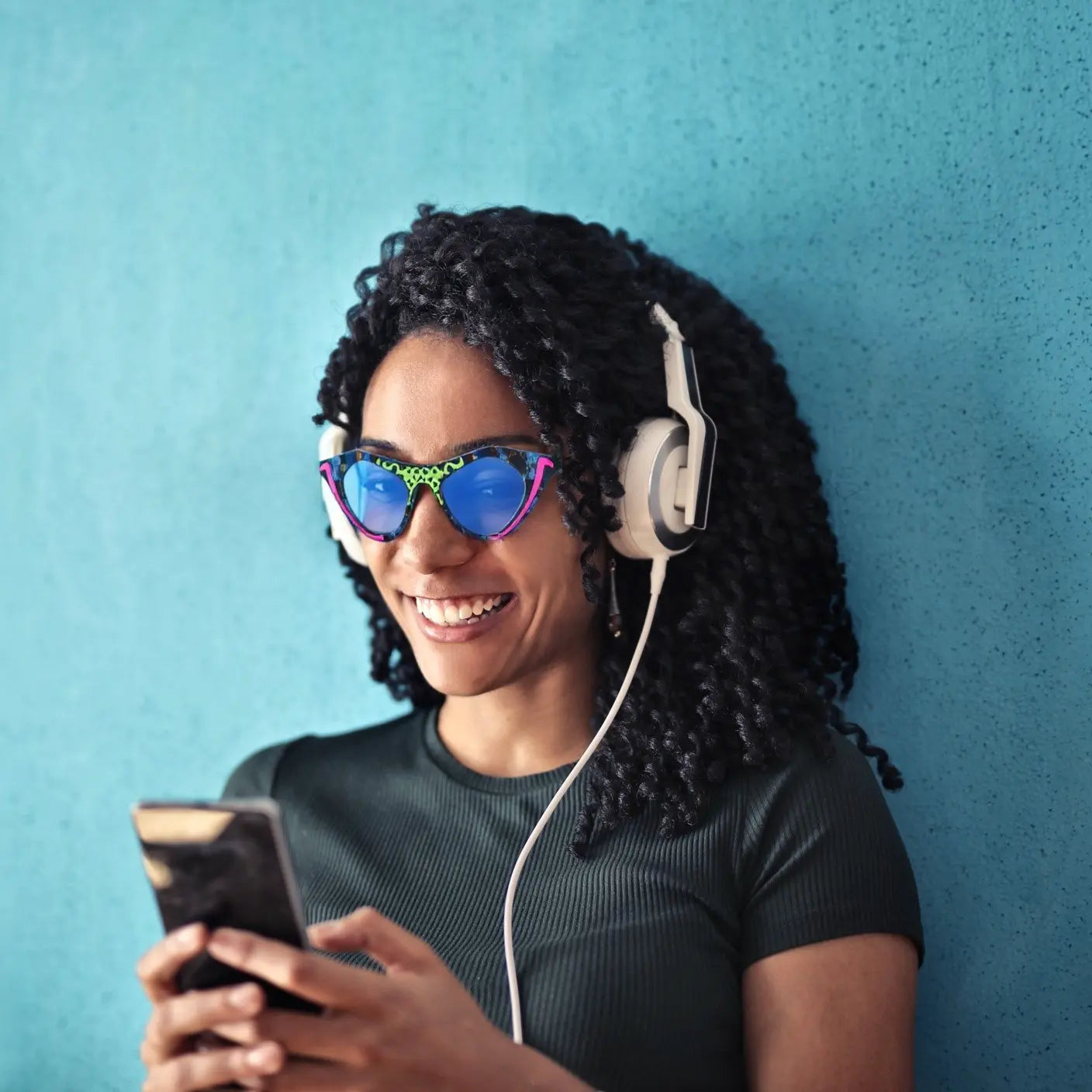 Streetwear model styled with Neon Pop VoyueLens™ pixel cat-eye glasses in vibrant look