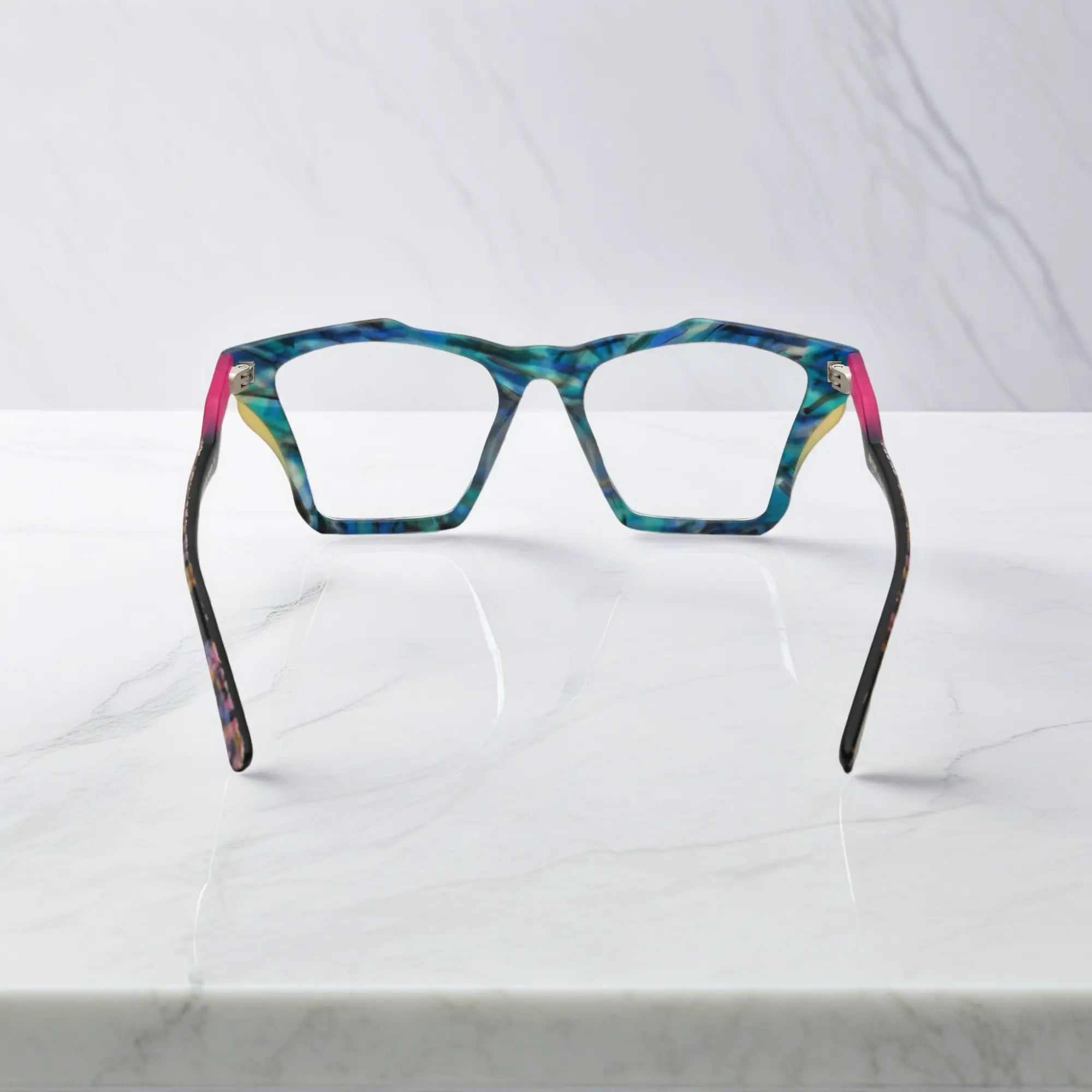 Rear view of VoyueLens™ Ocean Tortoiseshell frame, displaying matte teal and turquoise tortoiseshell finish from the inner frame and hinge area.