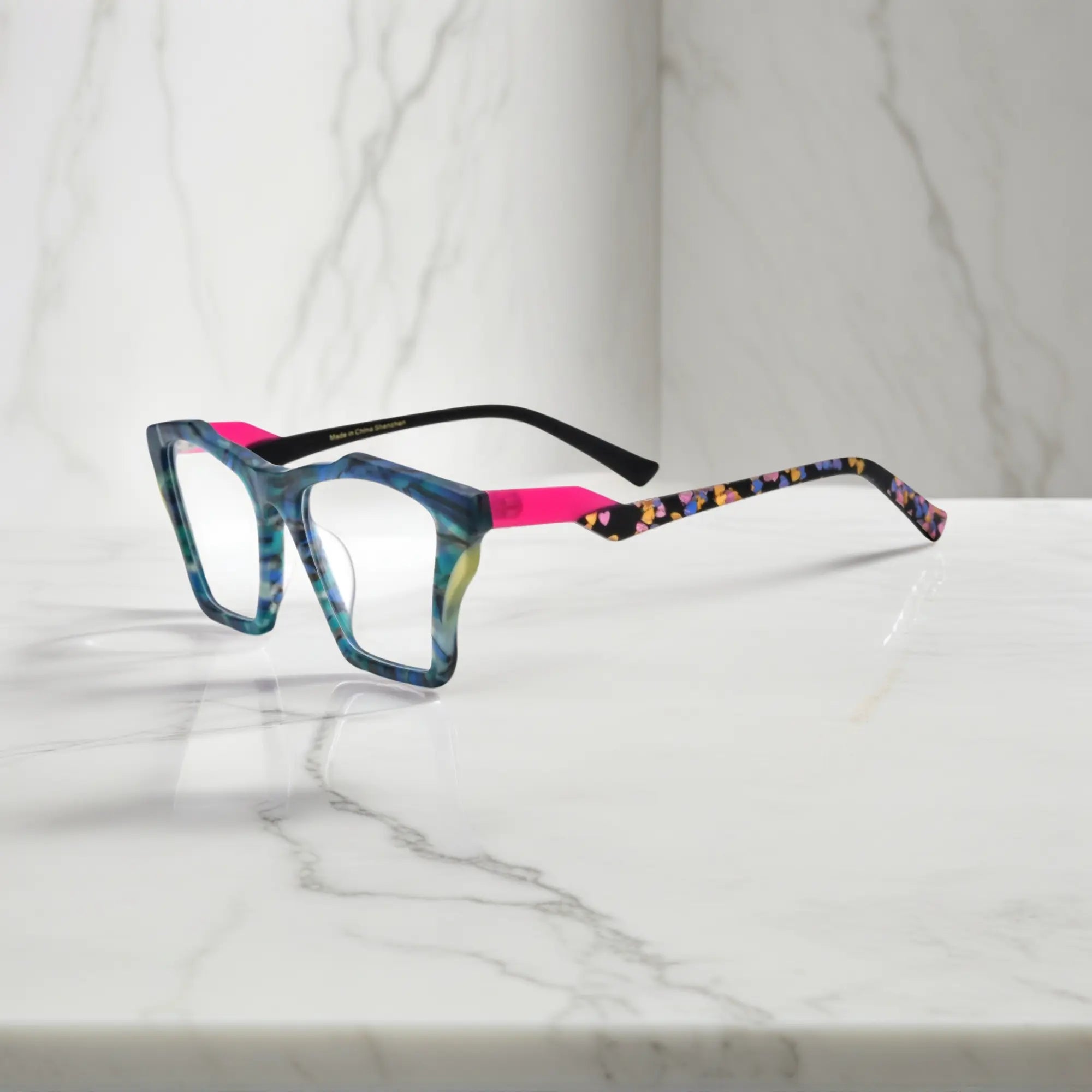 Side profile of VoyueLens™ Ocean Tortoiseshell glasses, highlighting matte teal and turquoise tortoiseshell finish and ergonomic acetate arms.