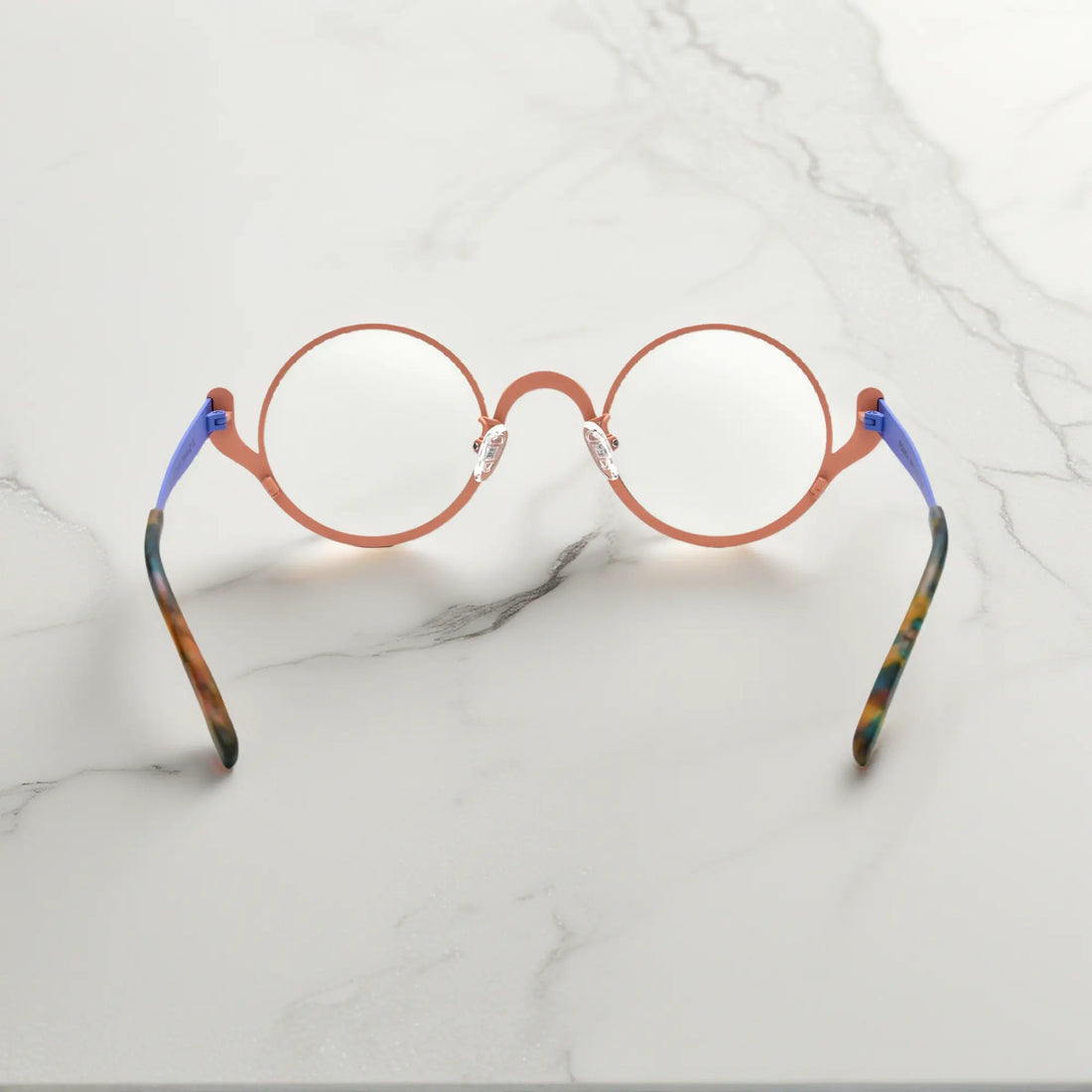 Back view of Pastel Forest VoyueLens™ titanium round glasses with curved temple arms