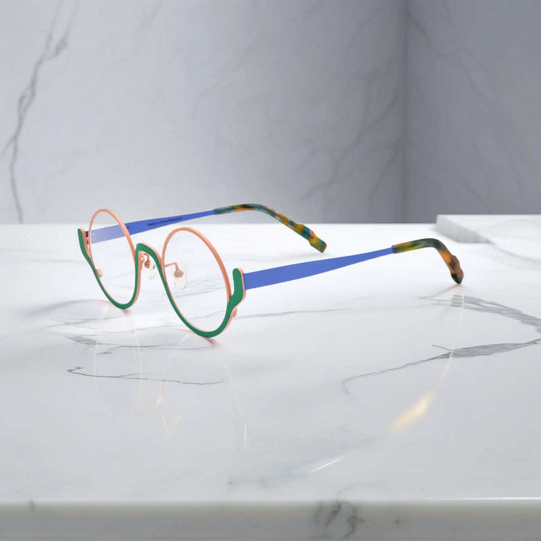 Side view showing blue titanium temple and tortoiseshell tips – Pastel Forest variant