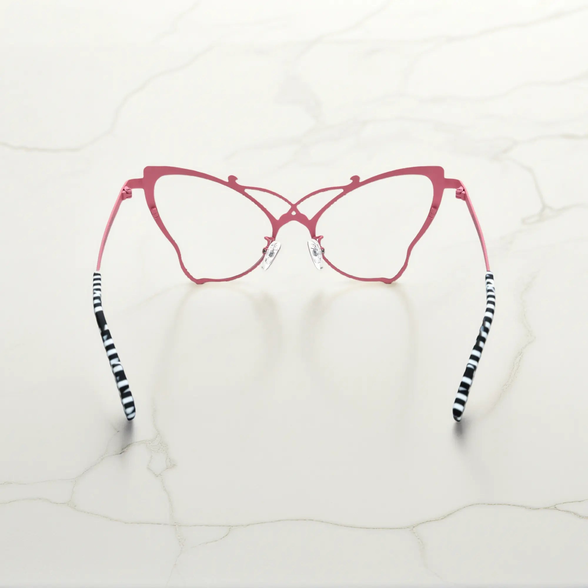 Back of VoyueLens™ VL185862 titanium butterfly eyeglasses in Pink Black – a lightweight, colorful, vintage-inspired, prescription ready frame designed for unique artistic style and everyday comfort.