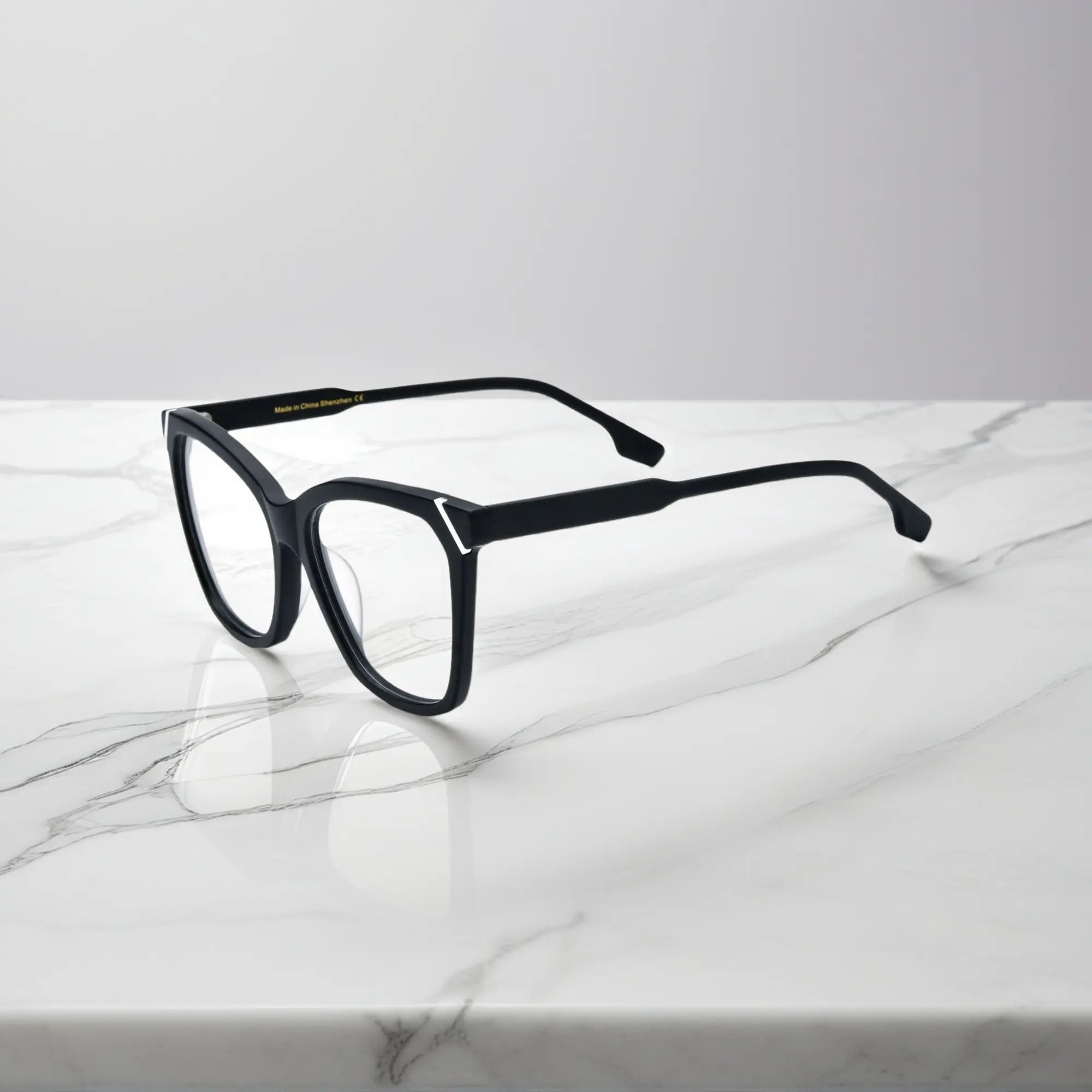 VoyueLens VL19343 Pure Onyx Black matte acetate square eyeglasses (unisex) are shown from the side view, highlighting the smooth black matte frame profile.