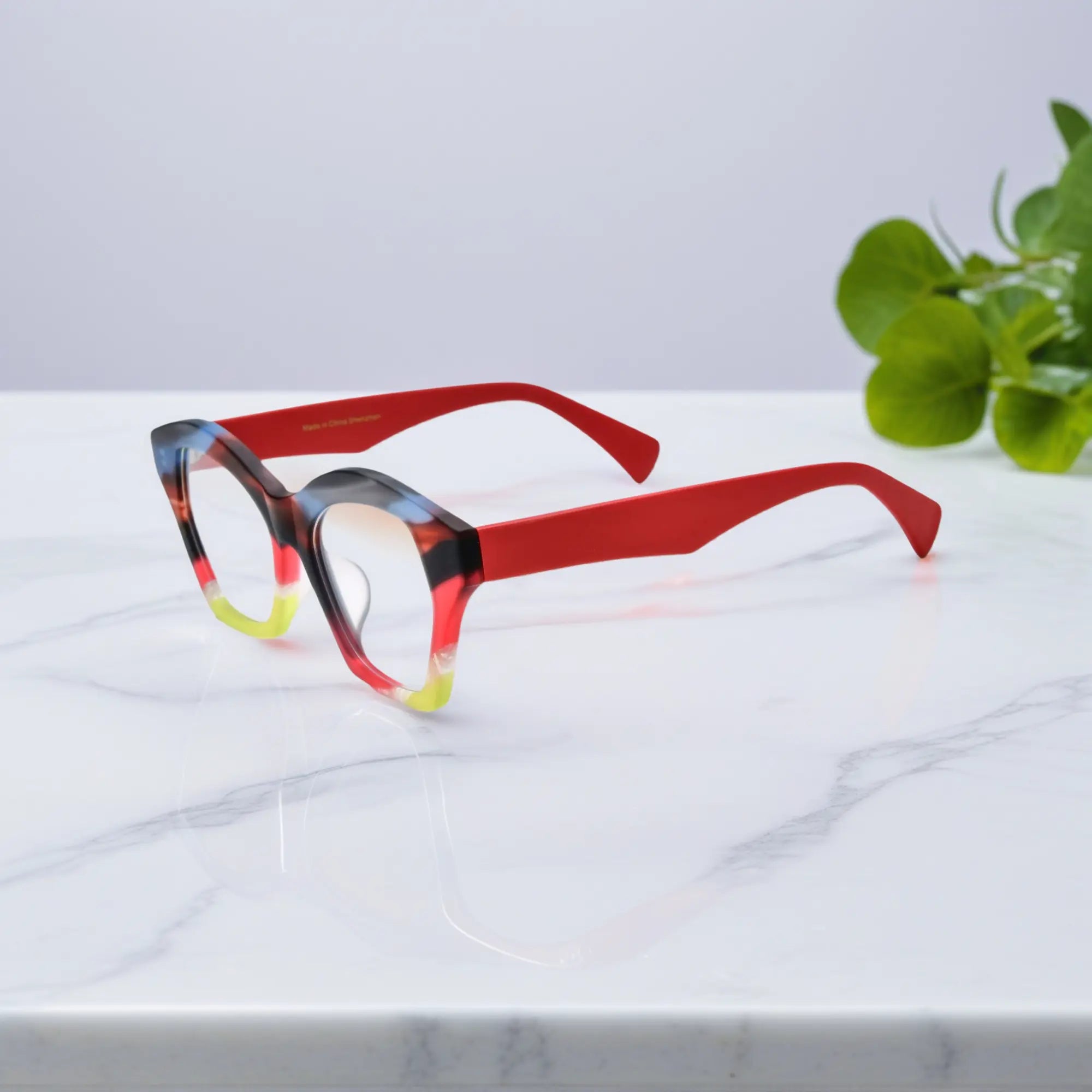 Side view of VoyueLens™ Rainbow Flame eyeglass frame in orange-red matte acetate with sleek curved arms.