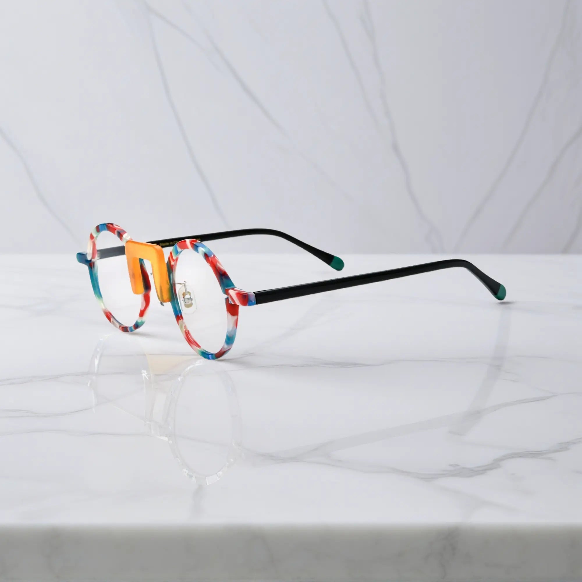 Side profile showing playful, multicolor acetate arms