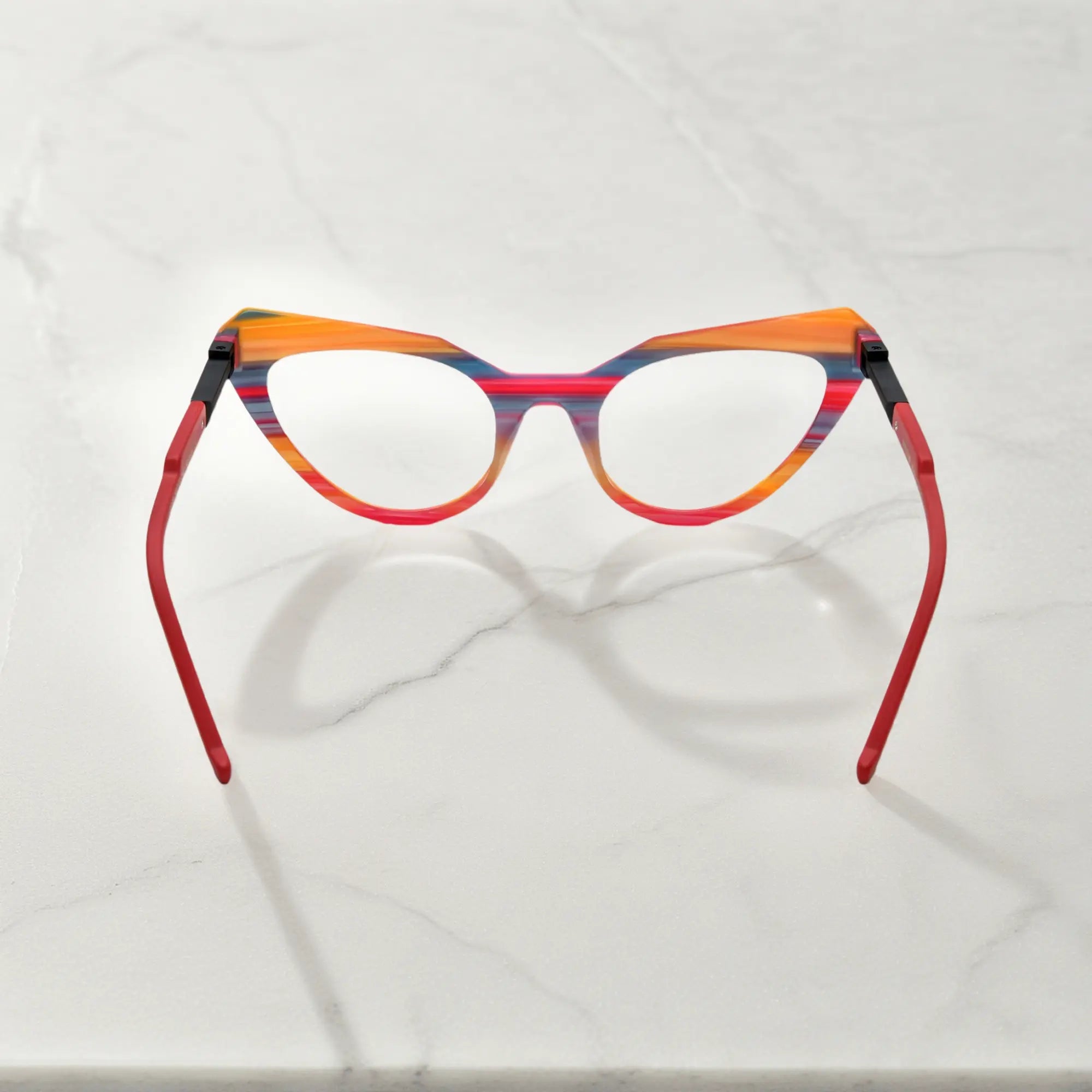 Rear angle showcasing Rainbow Stripe’s playful color-blocked design on the butterfly frame.