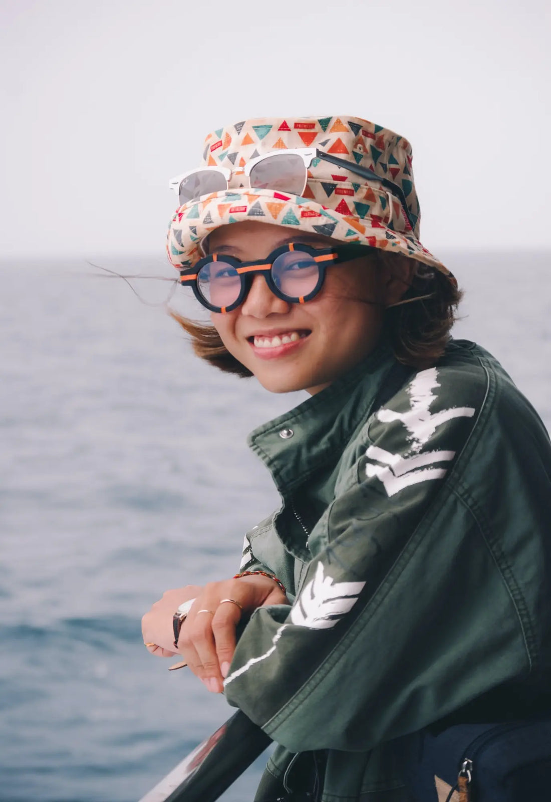 Model showcasing VoyueLens™ glasses in charcoal black with a modern matte texture.