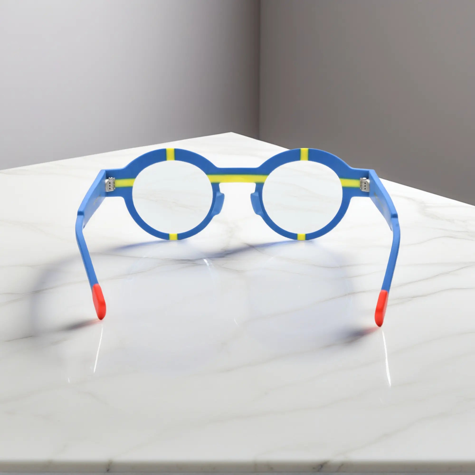 Angled look at cobalt blue VoyueLens™ glasses, styled with matte geometric detailing.