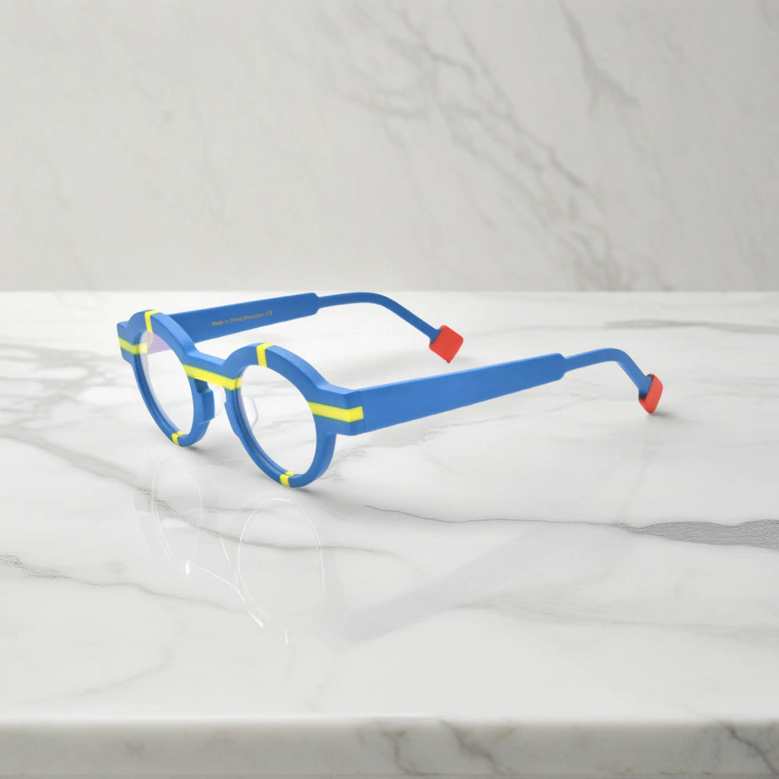Side profile highlighting cobalt blue acetate temples and modern matte surface.