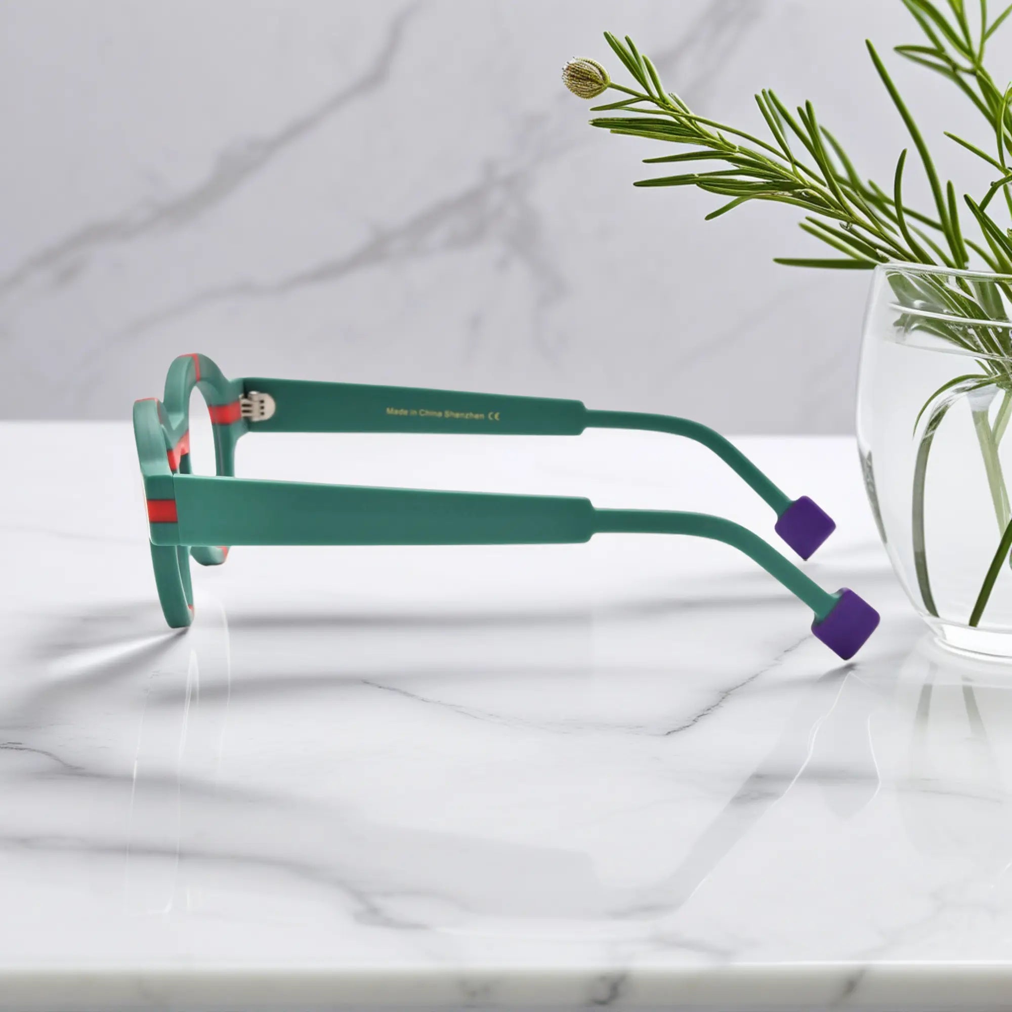 Side view of VoyueLens™ Retro Geometric Round Glasses in forest green, highlighting the acetate temple and matte surface.Purple highlights