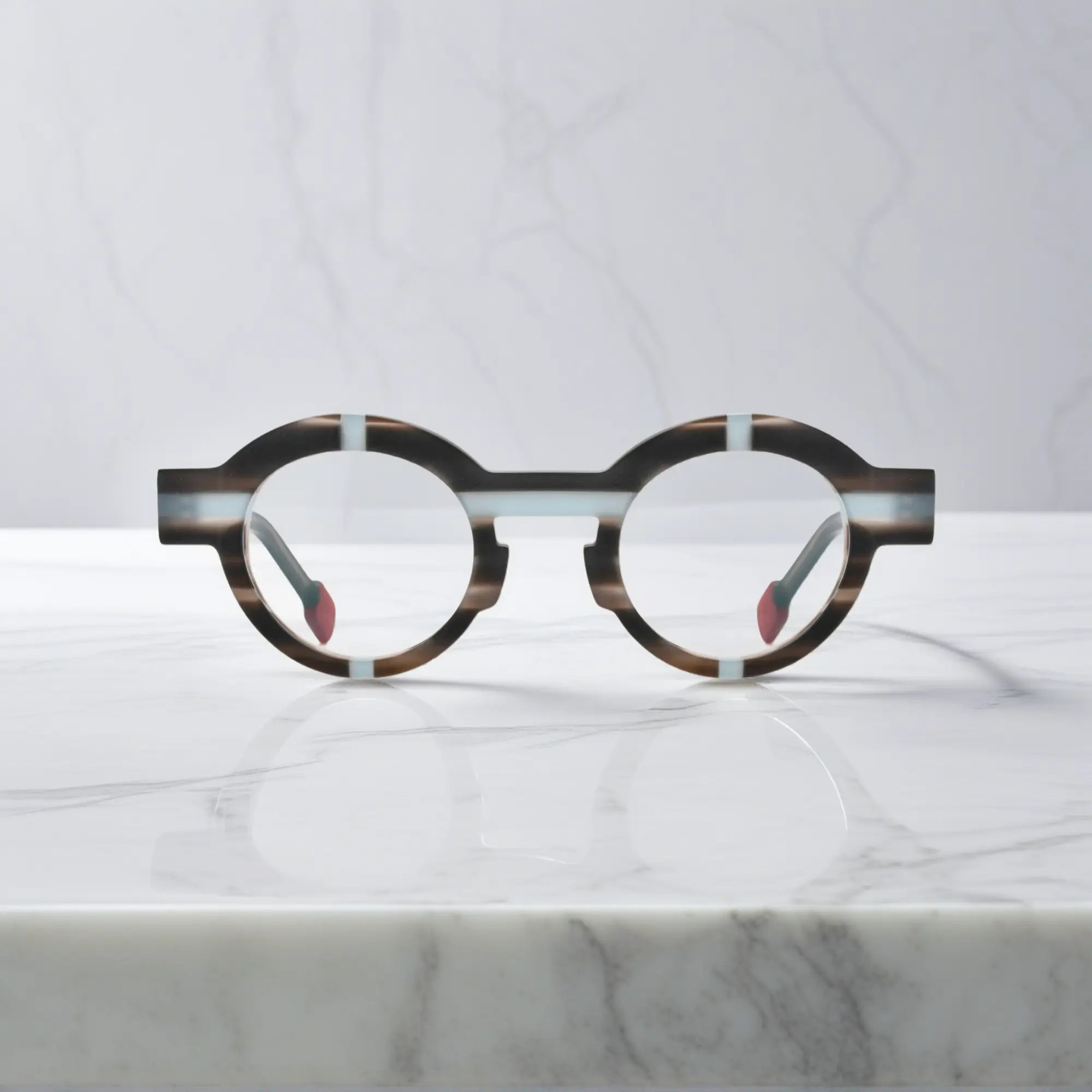 Front shot of VoyueLens™ glasses in slate gray with soft matte geometric round styling.