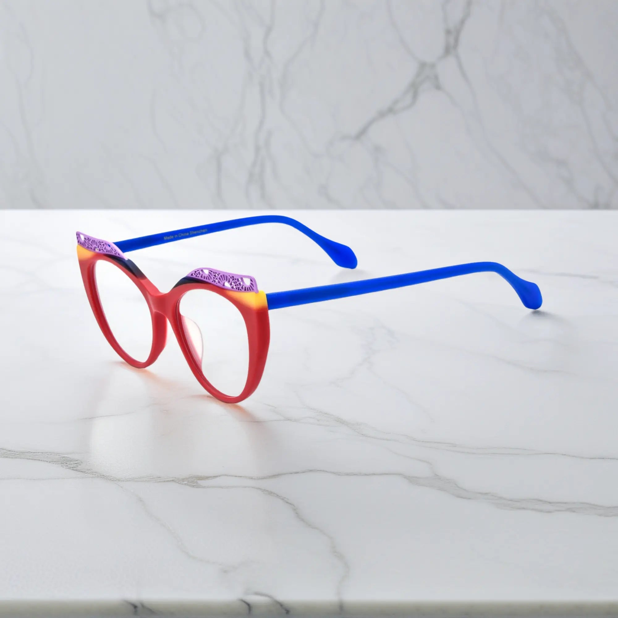 Side View of VoyueLens™ Scarlet Horizon cat-eye eyeglasses with red-to-orange gradient and signature lace-pattern design.