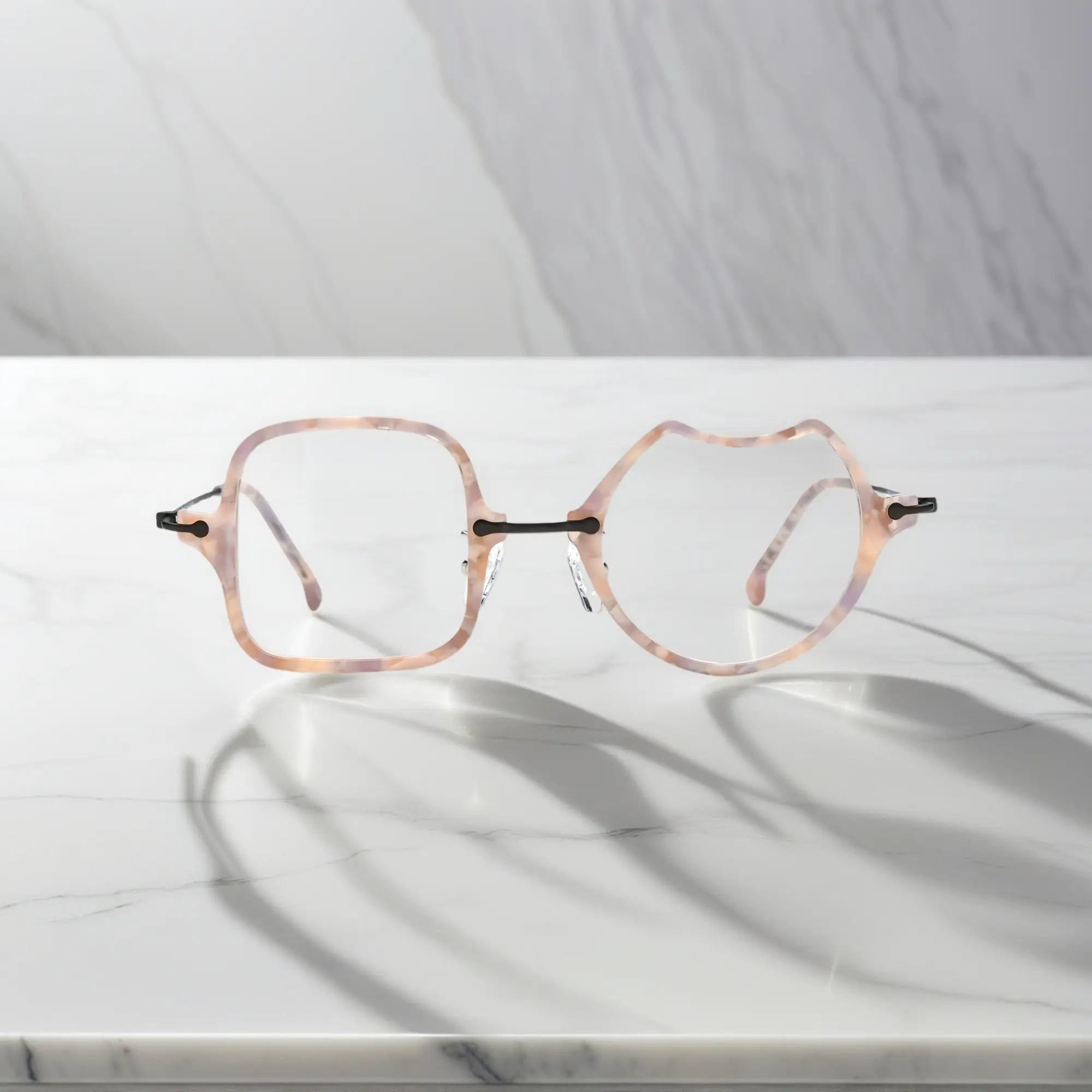 Front View of VoyueLens™ Shell Pink dual-shaped artistic eyeglasses VL185842-C3. Close-up of the front-facing design showing the asymmetric lens combination with acetate finish.