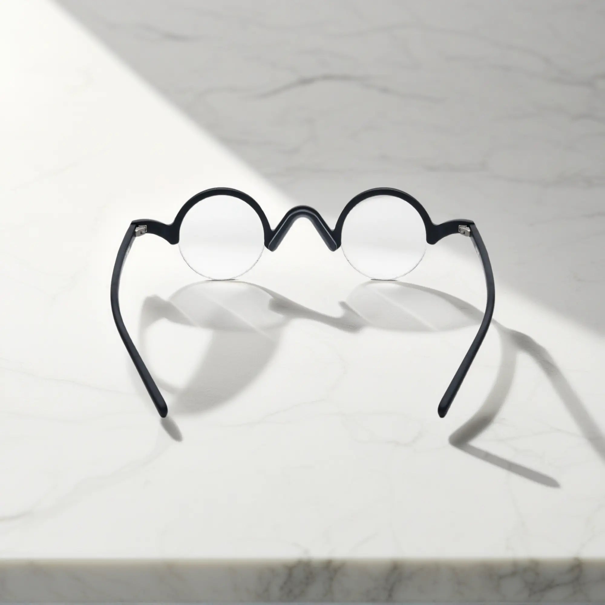 Back view of VoyueLens™ Solid Black semi-rimless browline eyeglasses showing frame and temple construction.