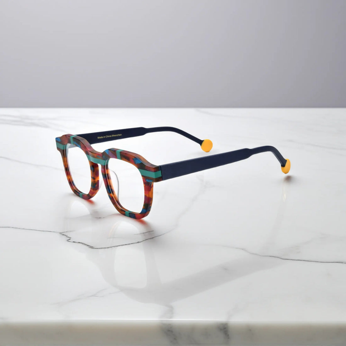 Side view of VoyueLens™ Tortoiseshell Flash eyeglasses with dark arms and yellow tips