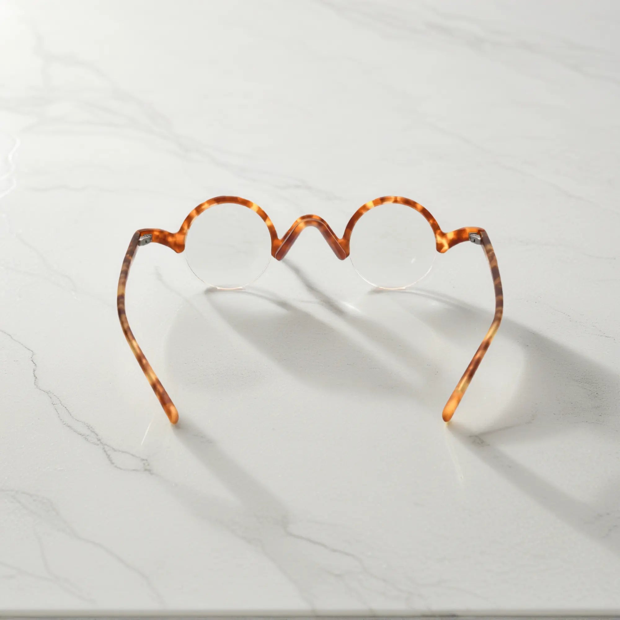 Rear view of VoyueLens™ Tortoiseshell semi-rimless browline eyeglasses emphasizing durable design.