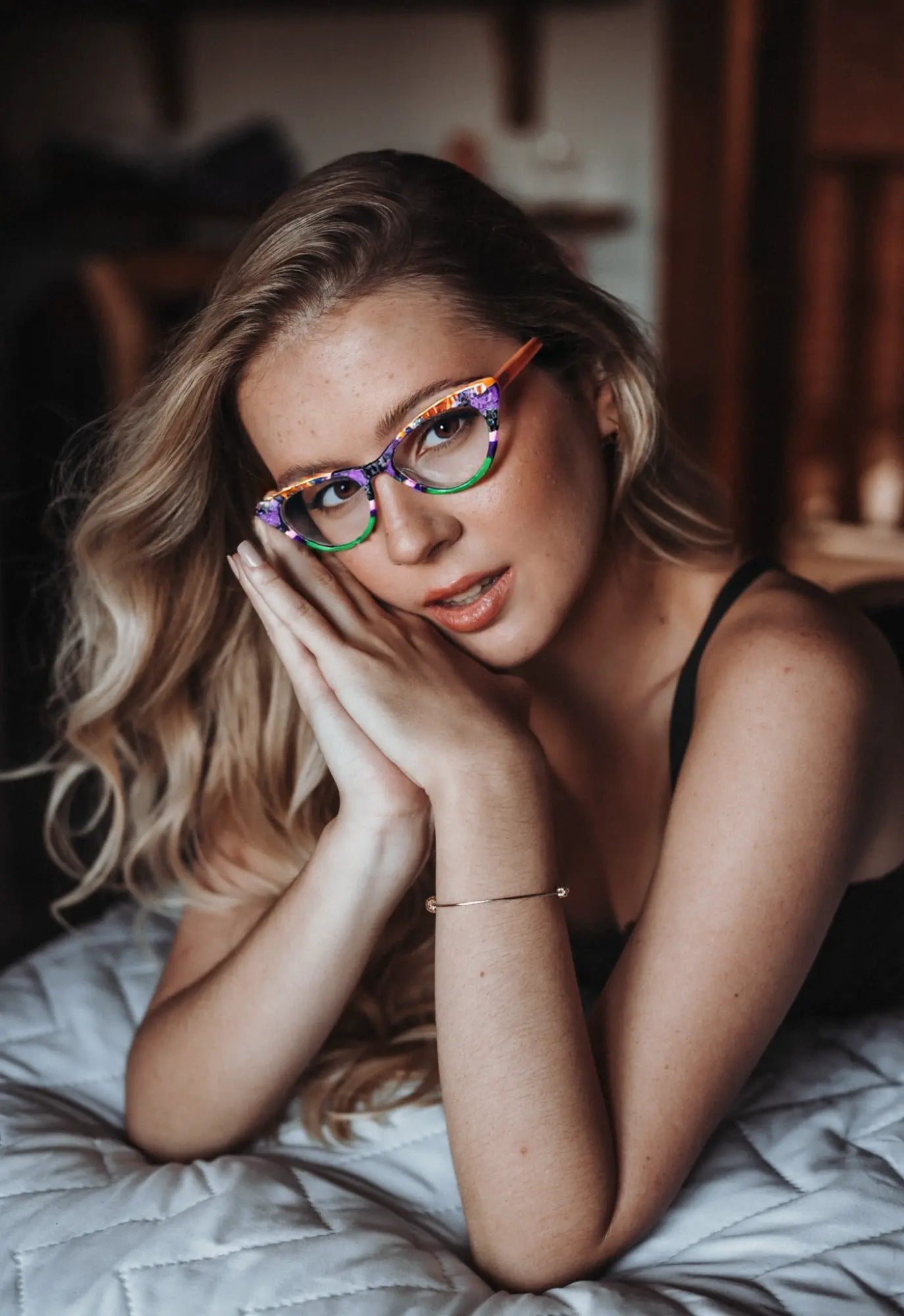 Model wearing VoyueLens™ KaleidoCat Violet Garden glasses in playful colors