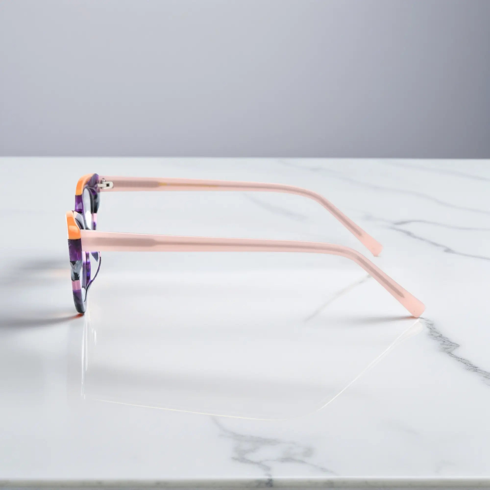 Side profile of VoyueLens™ Violet Garden cat-eye eyeglasses showing soft pink temples