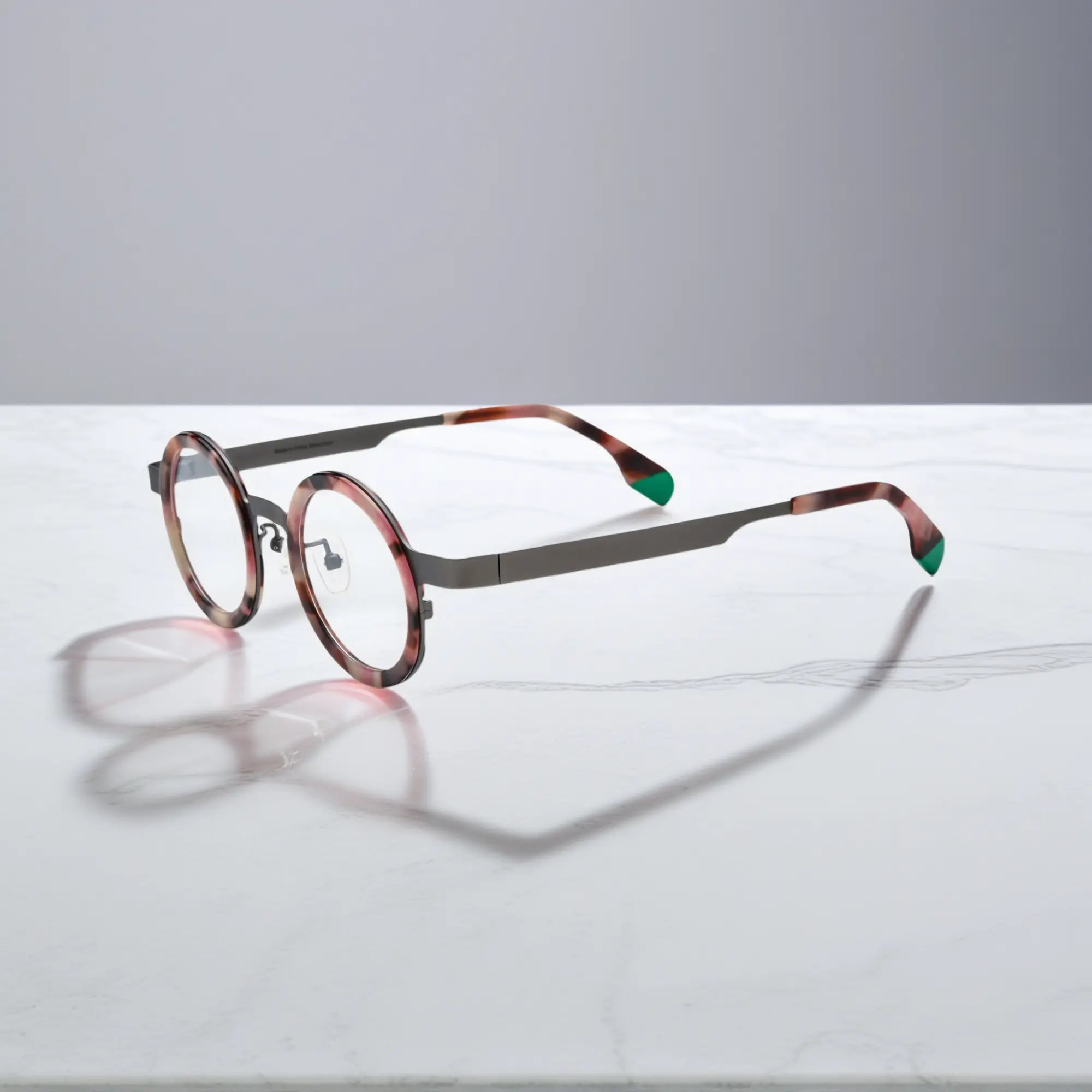 Side profile of Ash Leopard titanium round glasses