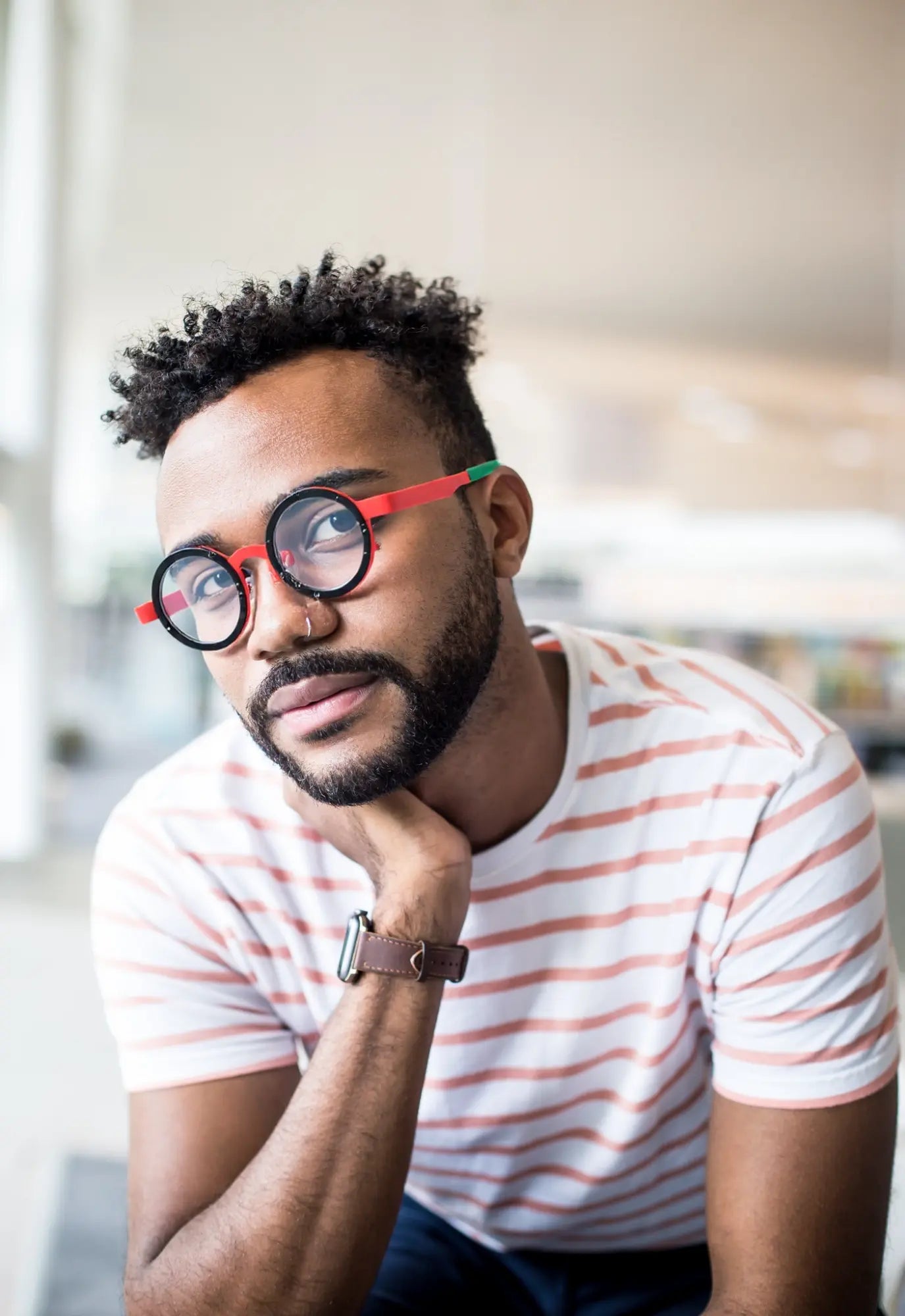 Model showcasing Crimson Tortoise titanium glasses