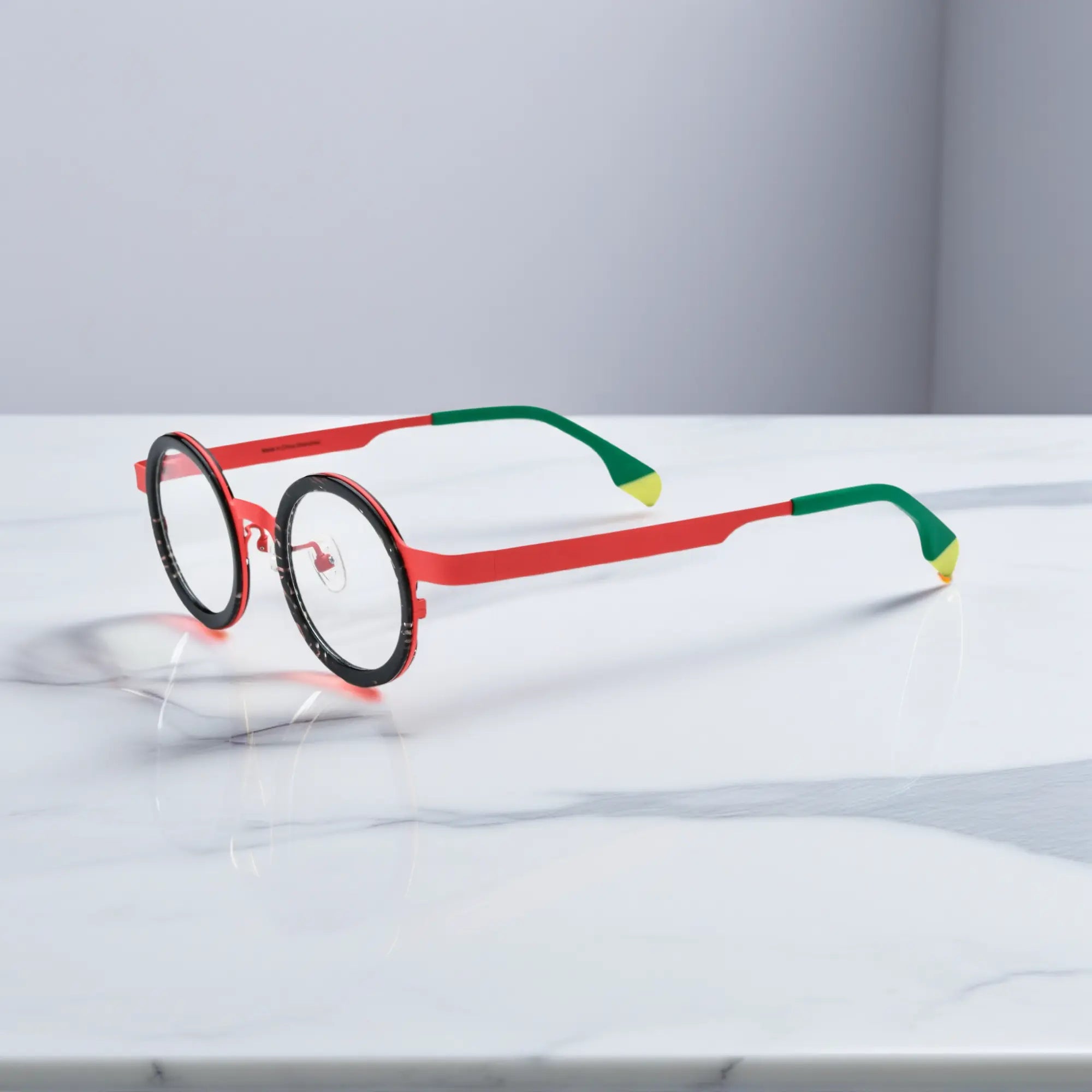 Side view of Crimson Tortoise round titanium glasses